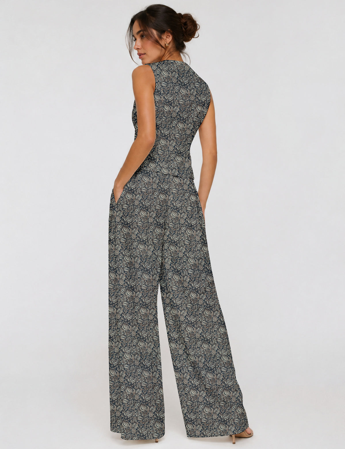 Women's tailored waistcoat set with a sleeveless V-neck button-front waistcoat and high-rise wide leg trousers in a coordinated matching outfit.