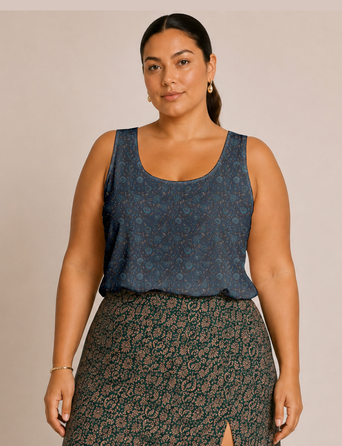 Women's sleeveless blouse with a relaxed straight fit, wide scoop neckline, deep scoop back, and hip-length silhouette.