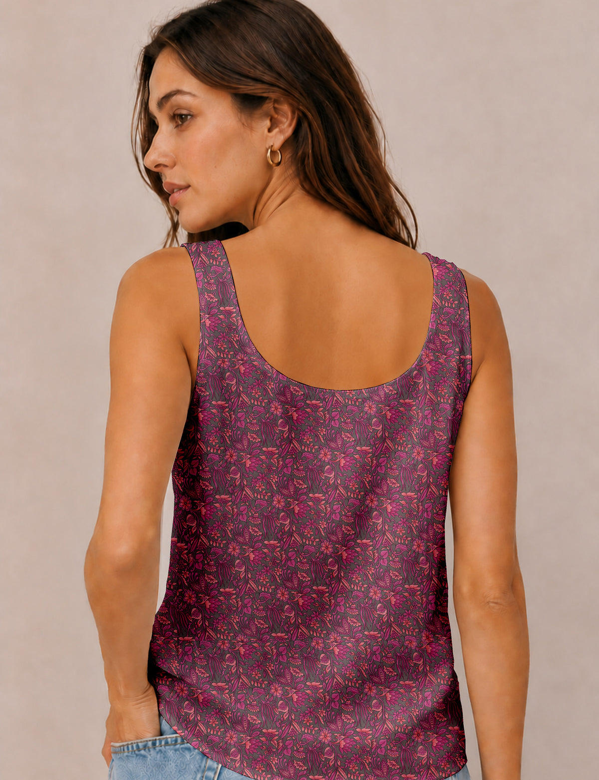 Women's sleeveless blouse with a relaxed straight fit, wide scoop neckline, deep scoop back, and hip-length silhouette.