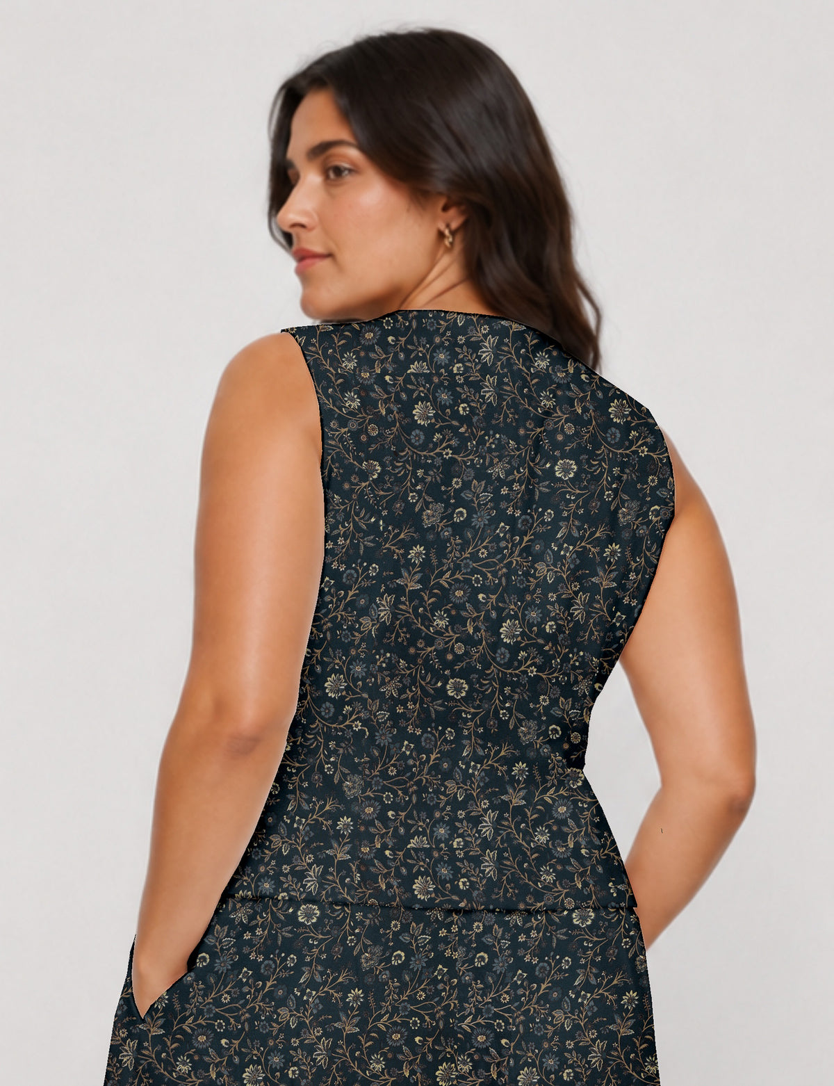 Women's fitted waistcoat with V-neck, single-breasted button closure, tailored silhouette, and pointed hem in sustainable fashion.