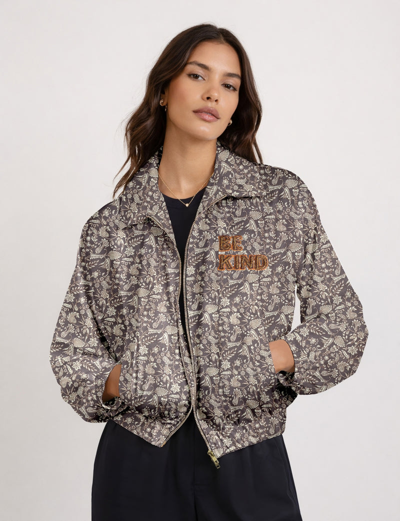 BE KIND Bomber jacket made from upcycled sari fabric with handcrafted Aari embroidery by female artisans.