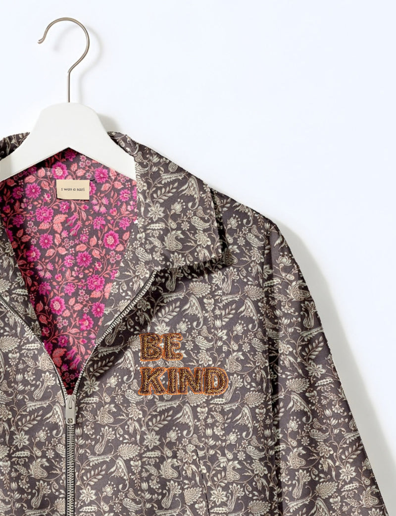BE KIND Bomber jacket made from upcycled sari fabric with handcrafted Aari embroidery by female artisans.