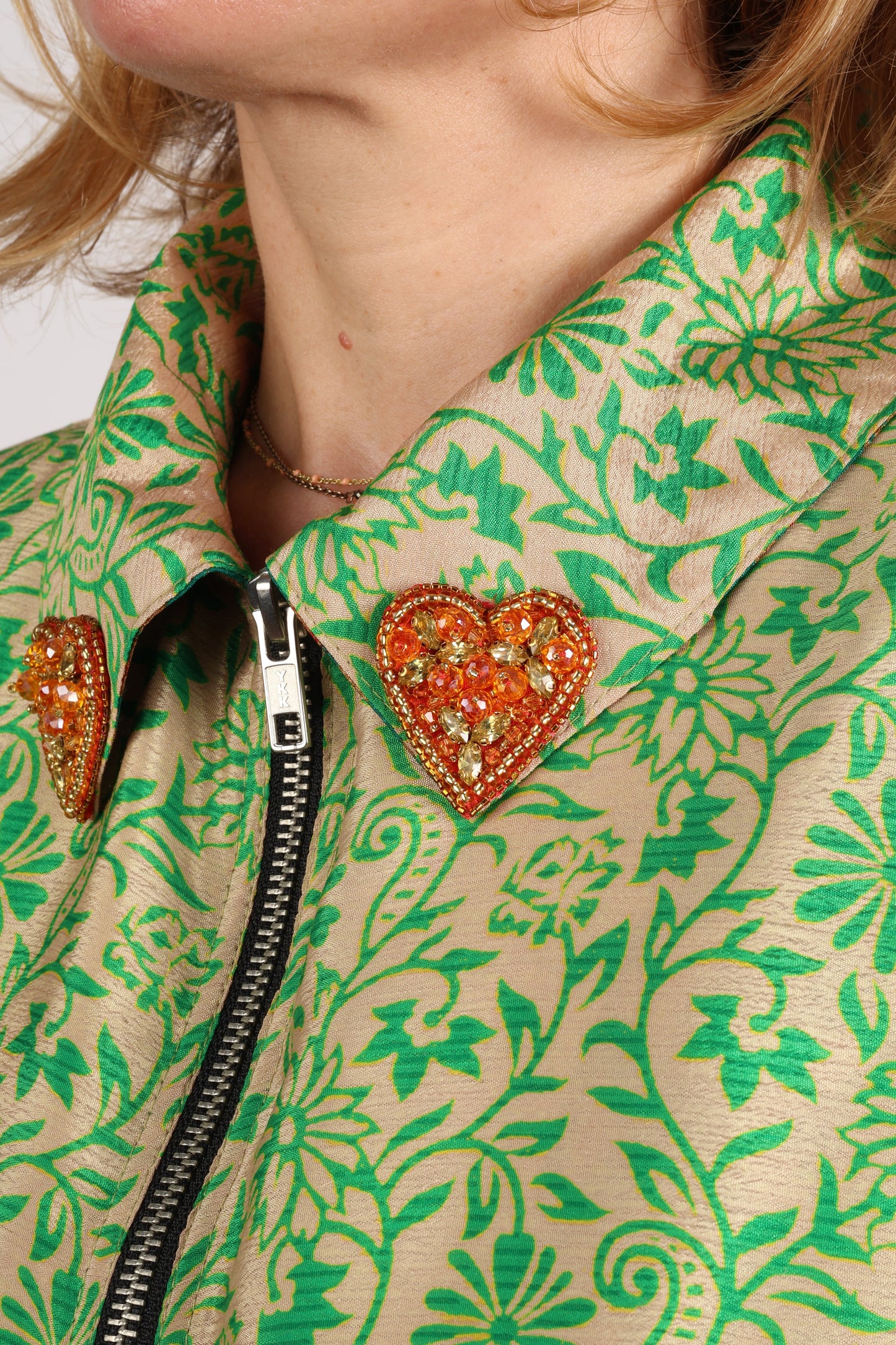 Make a bold statement with our Heart Drop Earrings, a symbol of conscious luxury and ethical fashion. Handcrafted using the intricate Aari embroidery technique, these earrings are made from upcycled sari fabric, embracing slow fashion and zero waste clothing. Elevate your look with sustainable apparel that supports fair trade fashion while reducing textile waste. Choose eco-friendly fashion that speaks of love, artistry, and responsibility.