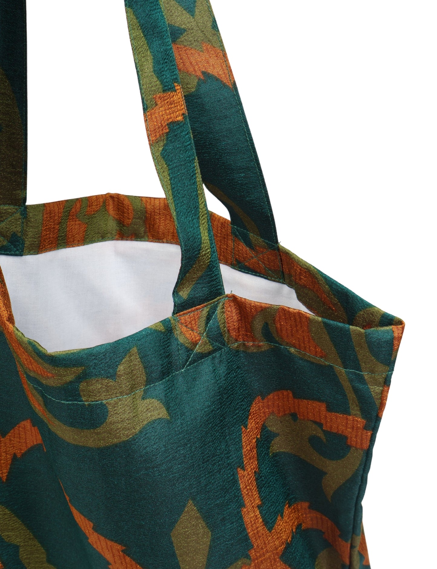 Colorful shopper bag made from recycled sari fabric, representing eco clothing, sustainable women's clothing, carbon neutral fashion, and repurposed clothing — ideal for environmentally friendly lifestyles and conscious clothing choices.
