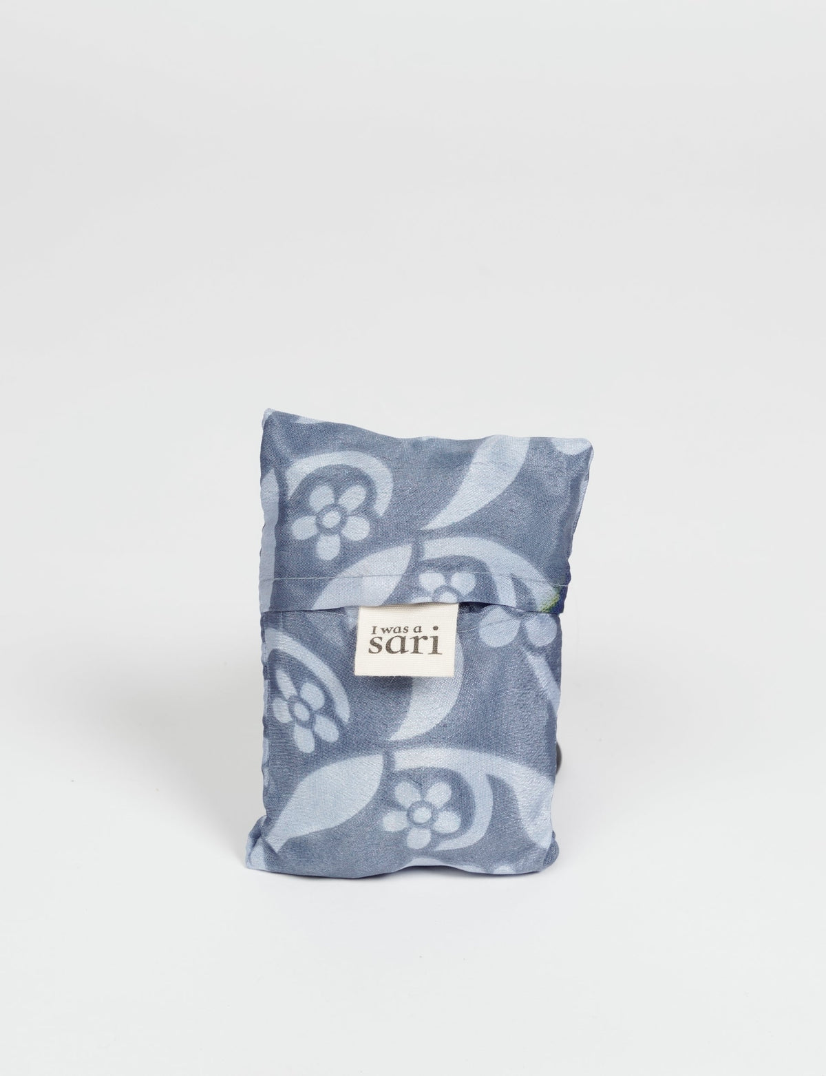 Stay eco-conscious with our Reusable Bag, handmade by Indian artisans from pre-loved saris. Silky and lightweight, this foldaway bag is perfect for your on-the-go lifestyle. Each piece is a unique statement of ethical fashion, embracing sustainability and style.