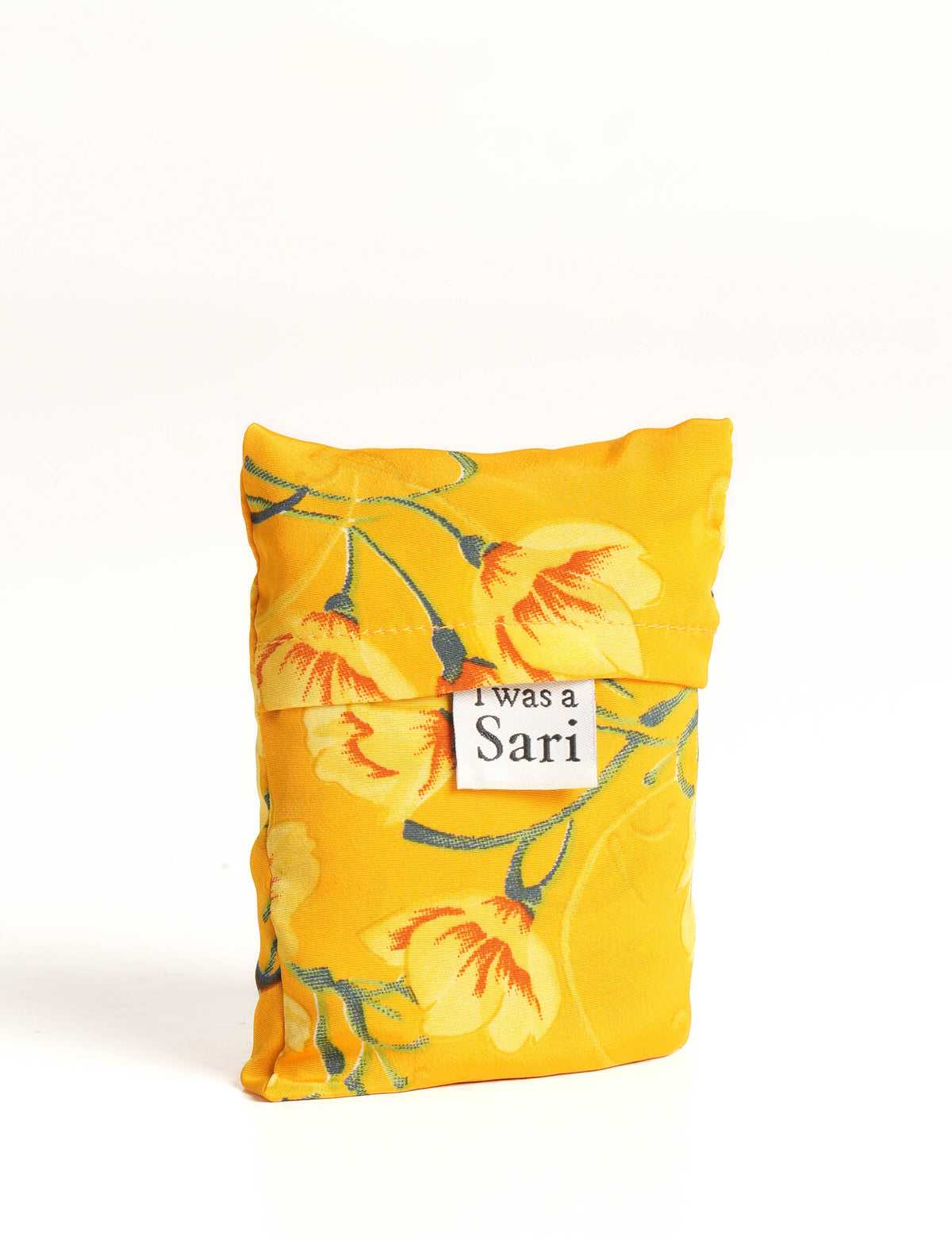 Stay eco-conscious with our Reusable Bag, handmade by Indian artisans from pre-loved saris. Silky and lightweight, this foldaway bag is perfect for your on-the-go lifestyle. Each piece is a unique statement of ethical fashion, embracing sustainability and style.