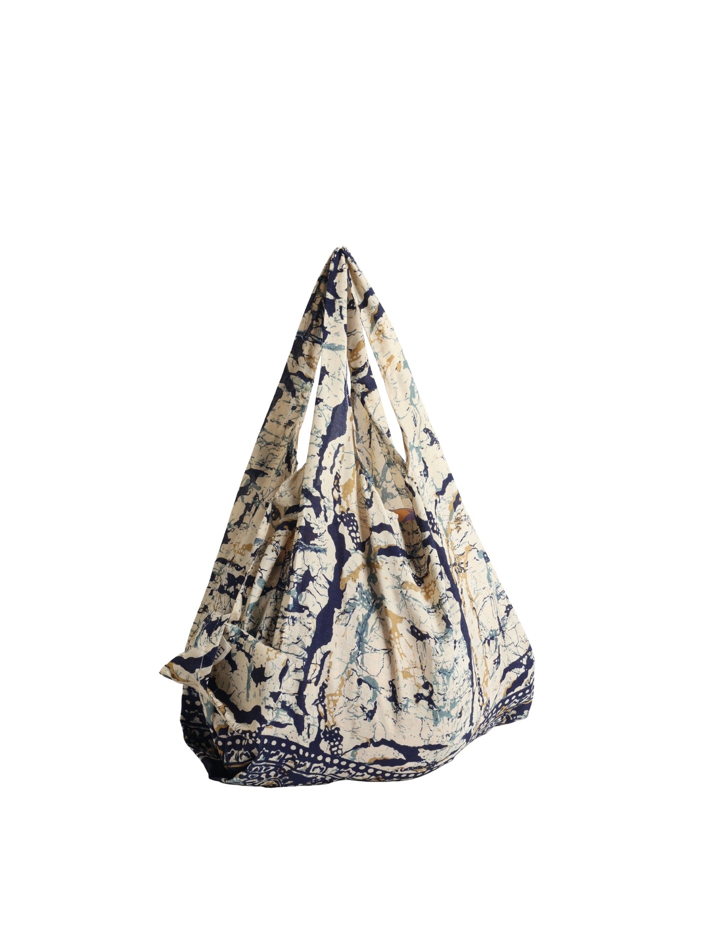 Stay eco-conscious with our Reusable Bag, handmade by Indian artisans from pre-loved saris. Silky and lightweight, this foldaway bag is perfect for your on-the-go lifestyle. Each piece is a unique statement of ethical fashion, embracing sustainability and style.