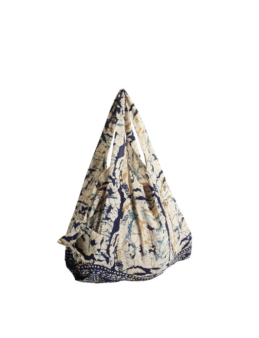 Stay eco-conscious with our Reusable Bag, handmade by Indian artisans from pre-loved saris. Silky and lightweight, this foldaway bag is perfect for your on-the-go lifestyle. Each piece is a unique statement of ethical fashion, embracing sustainability and style.