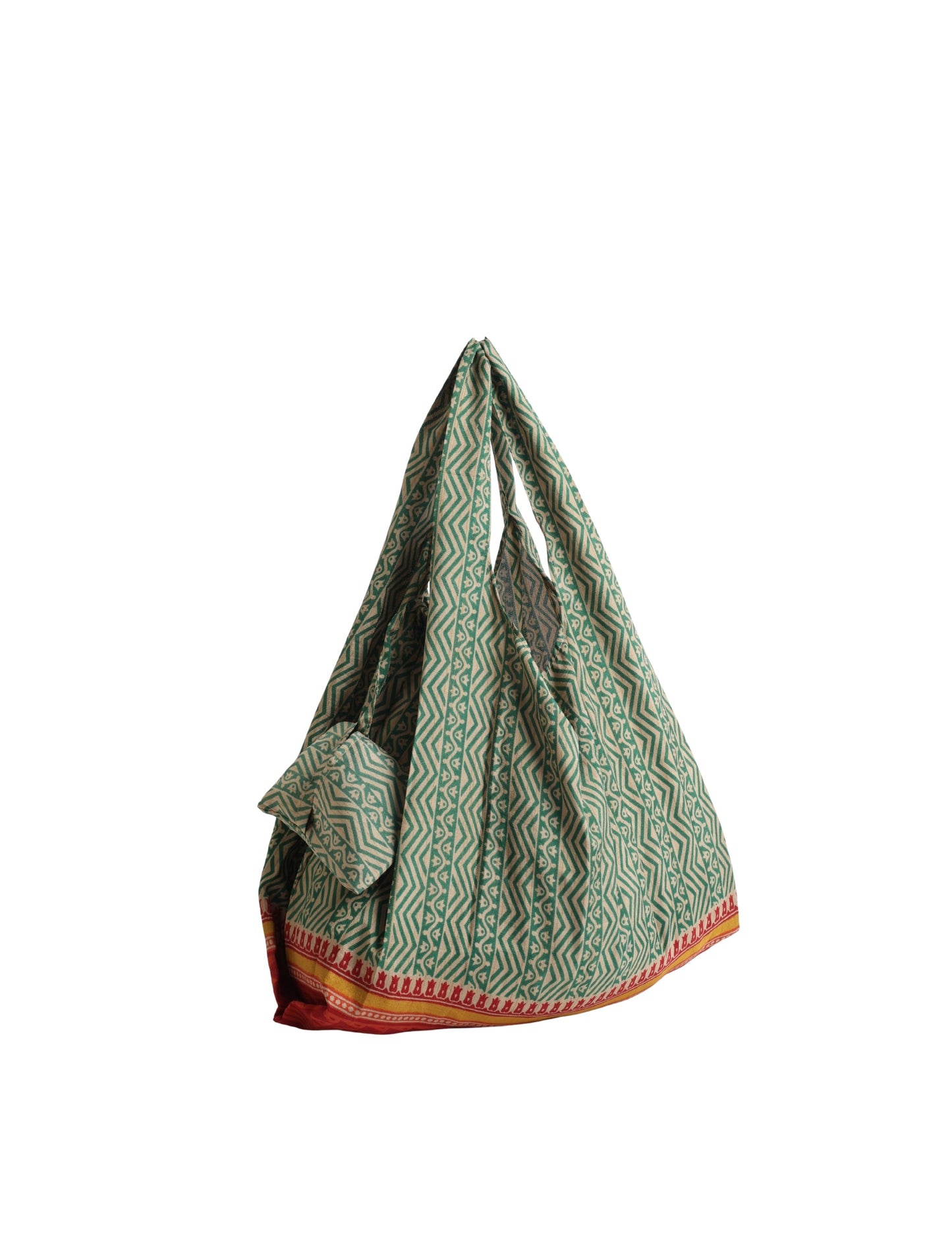 Stay eco-conscious with our Reusable Bag, handmade by Indian artisans from pre-loved saris. Silky and lightweight, this foldaway bag is perfect for your on-the-go lifestyle. Each piece is a unique statement of ethical fashion, embracing sustainability and style.