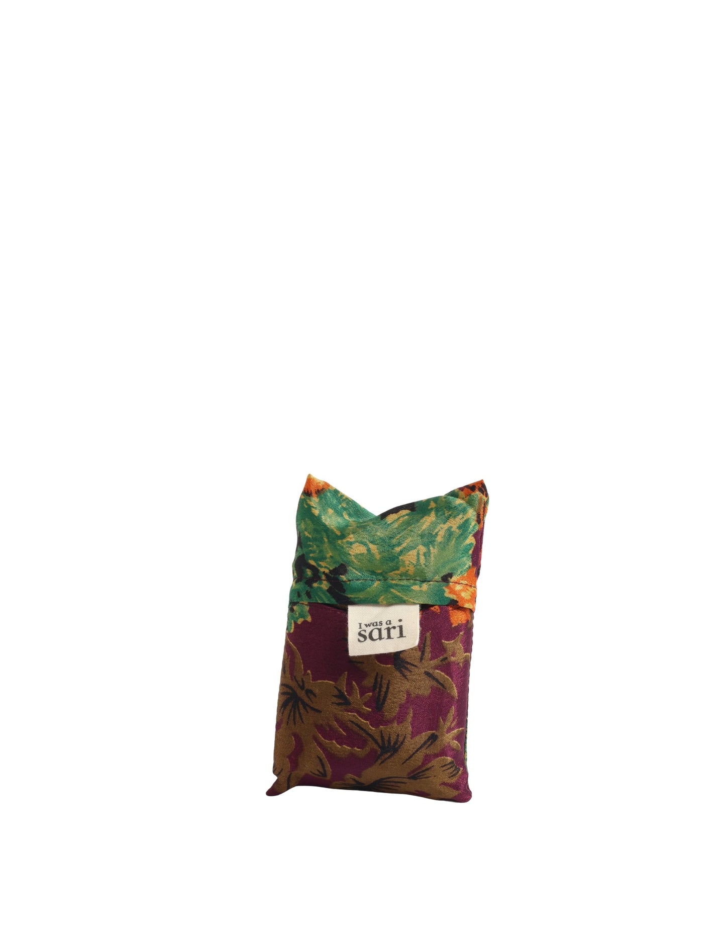 Stay eco-conscious with our Reusable Bag, handmade by Indian artisans from pre-loved saris. Silky and lightweight, this foldaway bag is perfect for your on-the-go lifestyle. Each piece is a unique statement of ethical fashion, embracing sustainability and style.