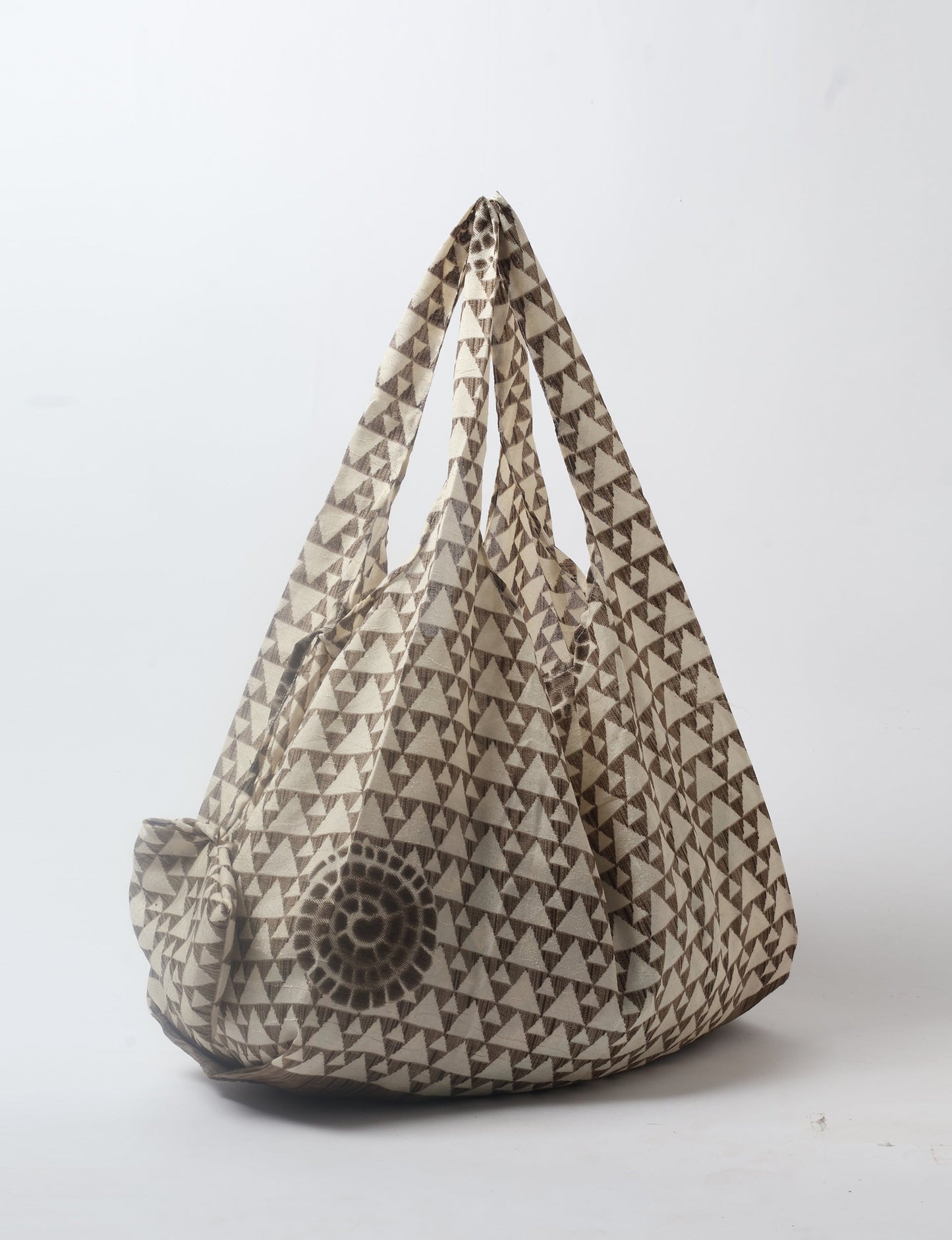 Stay eco-conscious with our Reusable Bag, handmade by Indian artisans from pre-loved saris. Silky and lightweight, this foldaway bag is perfect for your on-the-go lifestyle. Each piece is a unique statement of ethical fashion, embracing sustainability and style.