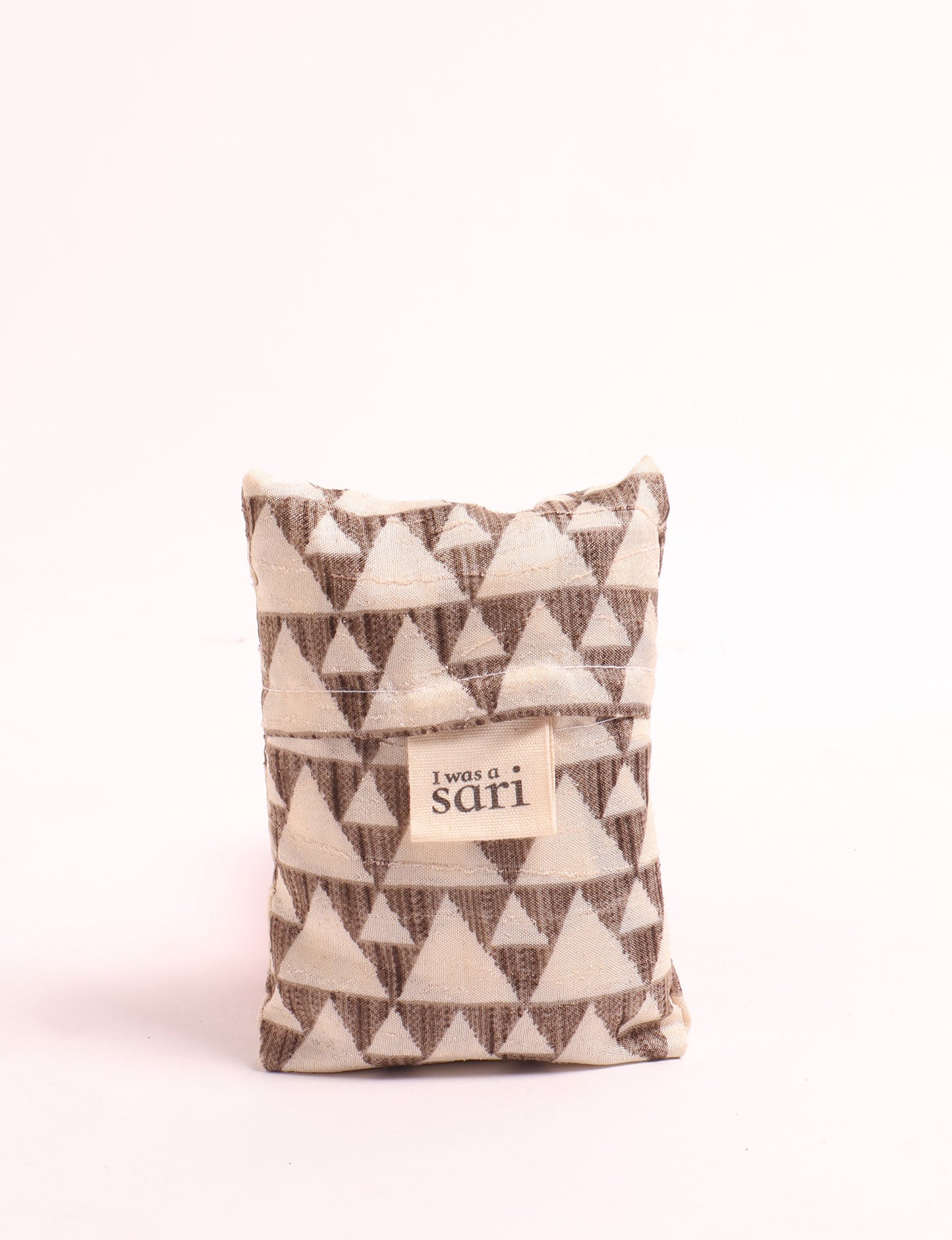 Stay eco-conscious with our Reusable Bag, handmade by Indian artisans from pre-loved saris. Silky and lightweight, this foldaway bag is perfect for your on-the-go lifestyle. Each piece is a unique statement of ethical fashion, embracing sustainability and style.