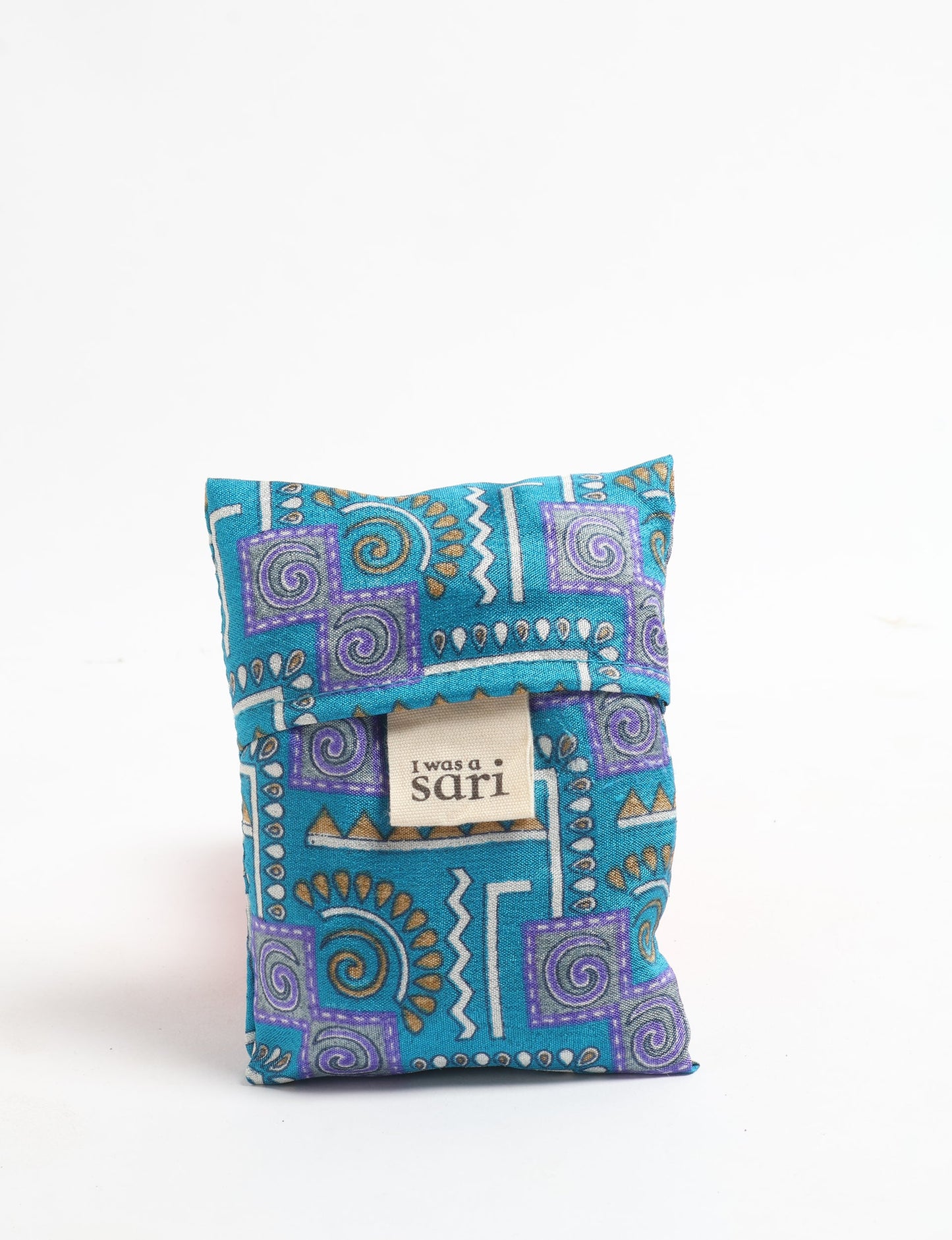 Stay eco-conscious with our Reusable Bag, handmade by Indian artisans from pre-loved saris. Silky and lightweight, this foldaway bag is perfect for your on-the-go lifestyle. Each piece is a unique statement of ethical fashion, embracing sustainability and style.