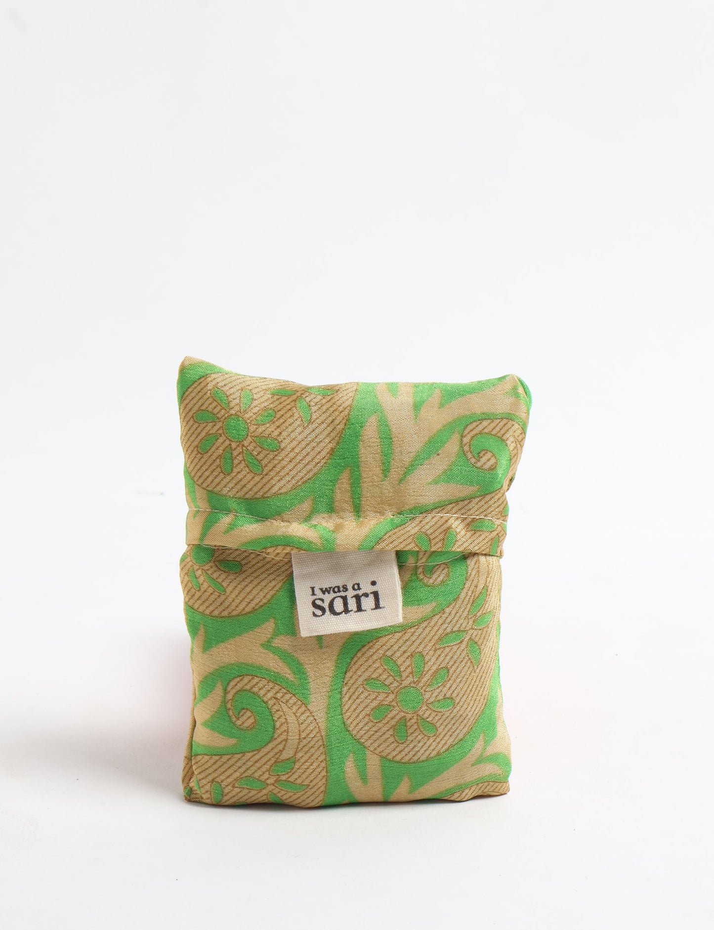 Stay eco-conscious with our Reusable Bag, handmade by Indian artisans from pre-loved saris. Silky and lightweight, this foldaway bag is perfect for your on-the-go lifestyle. Each piece is a unique statement of ethical fashion, embracing sustainability and style.