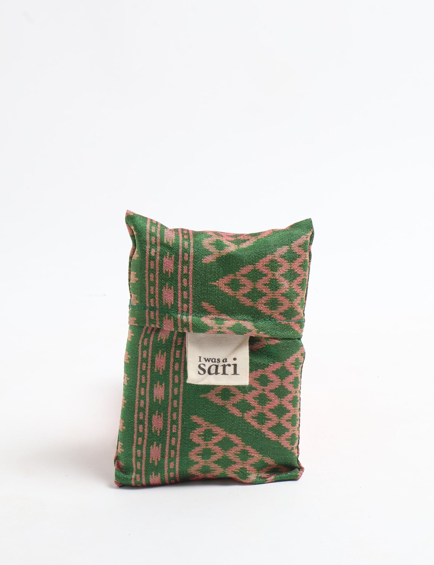 Stay eco-conscious with our Reusable Bag, handmade by Indian artisans from pre-loved saris. Silky and lightweight, this foldaway bag is perfect for your on-the-go lifestyle. Each piece is a unique statement of ethical fashion, embracing sustainability and style.