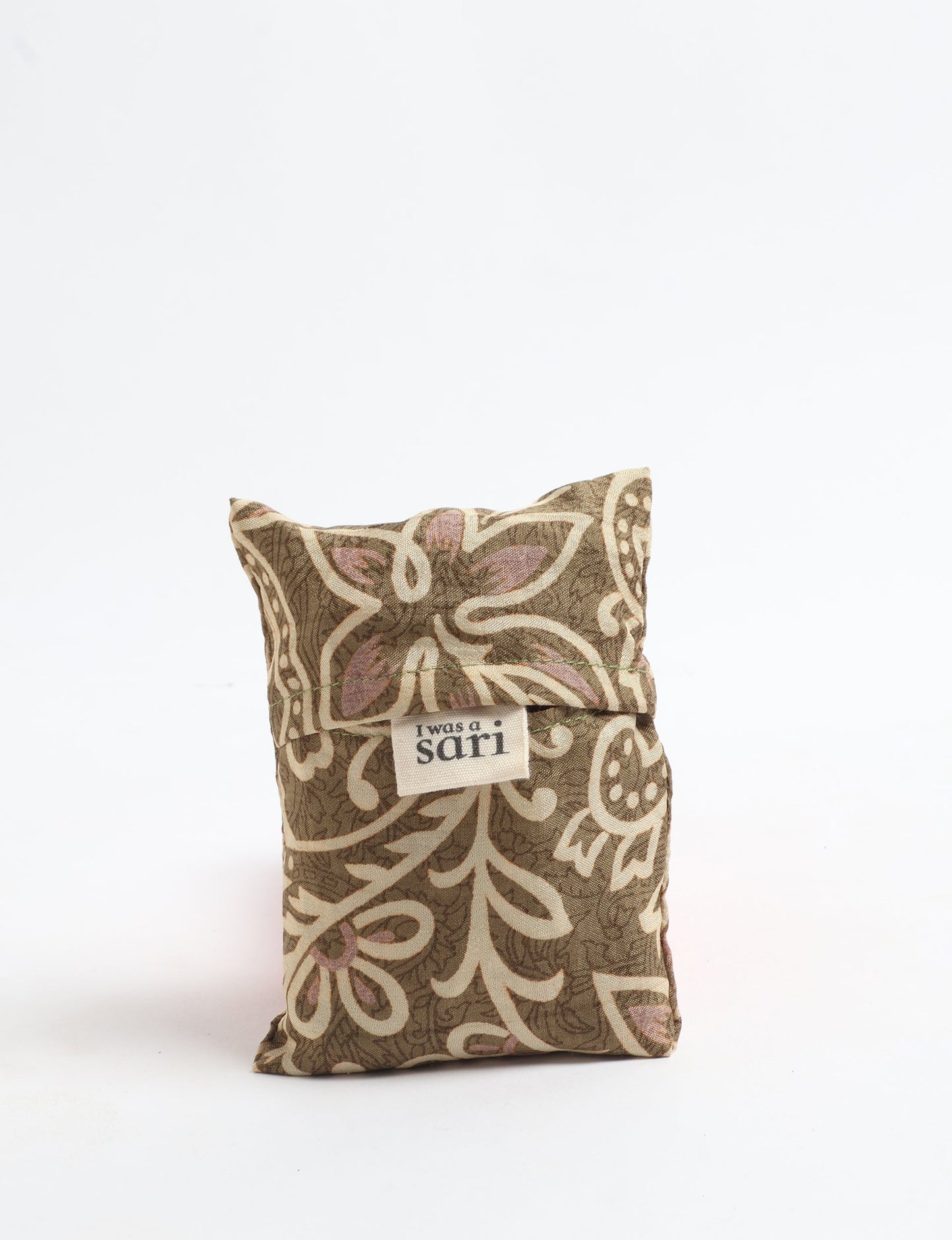 Stay eco-conscious with our Reusable Bag, handmade by Indian artisans from pre-loved saris. Silky and lightweight, this foldaway bag is perfect for your on-the-go lifestyle. Each piece is a unique statement of ethical fashion, embracing sustainability and style.