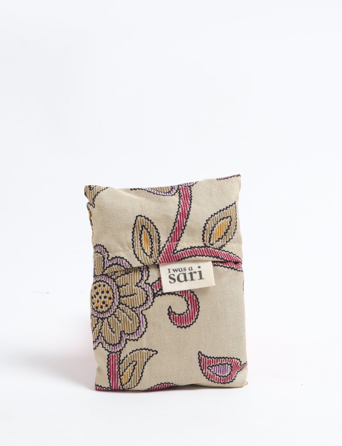 Stay eco-conscious with our Reusable Bag, handmade by Indian artisans from pre-loved saris. Silky and lightweight, this foldaway bag is perfect for your on-the-go lifestyle. Each piece is a unique statement of ethical fashion, embracing sustainability and style.