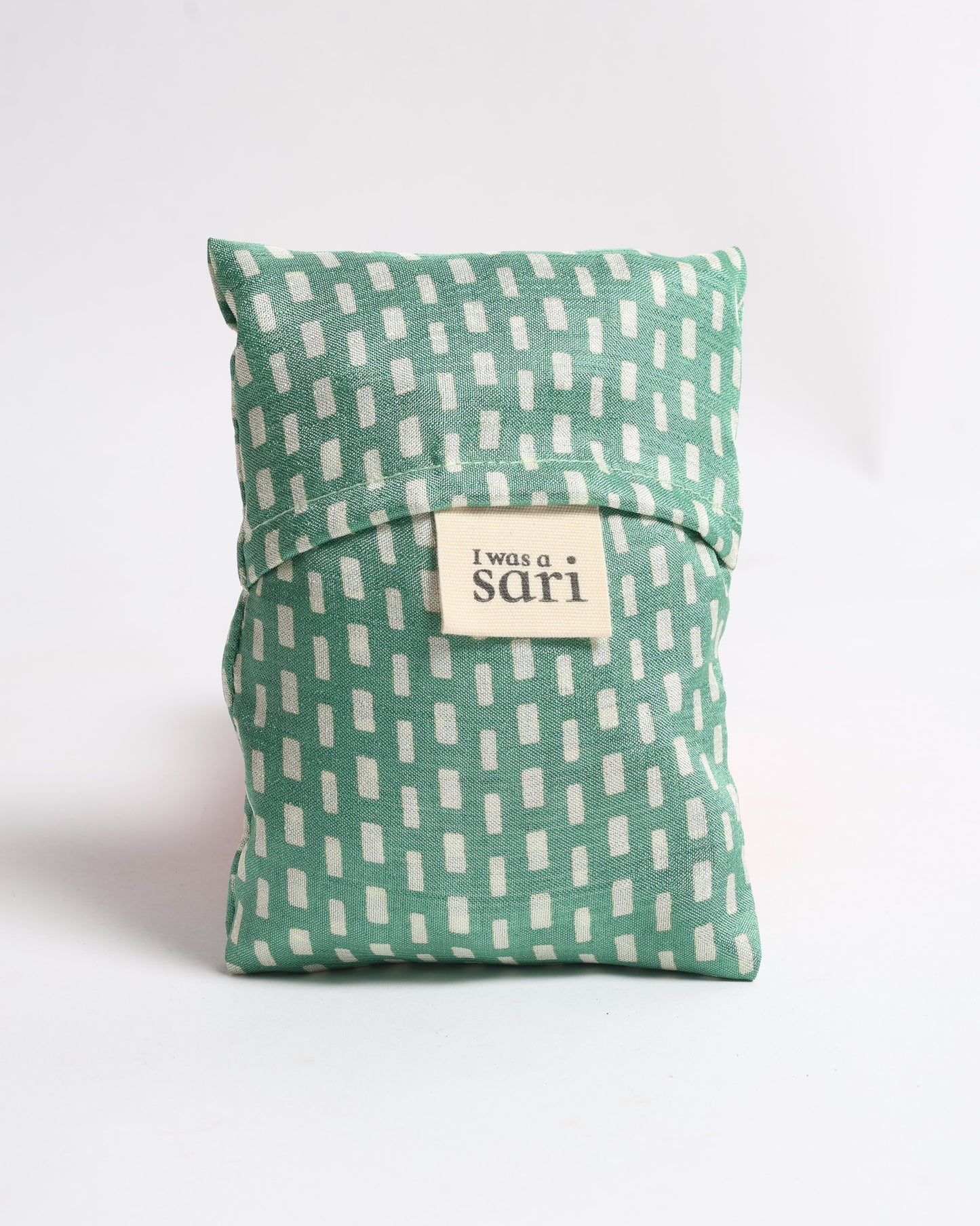 Stay eco-conscious with our Reusable Bag, handmade by Indian artisans from pre-loved saris. Silky and lightweight, this foldaway bag is perfect for your on-the-go lifestyle. Each piece is a unique statement of ethical fashion, embracing sustainability and style.