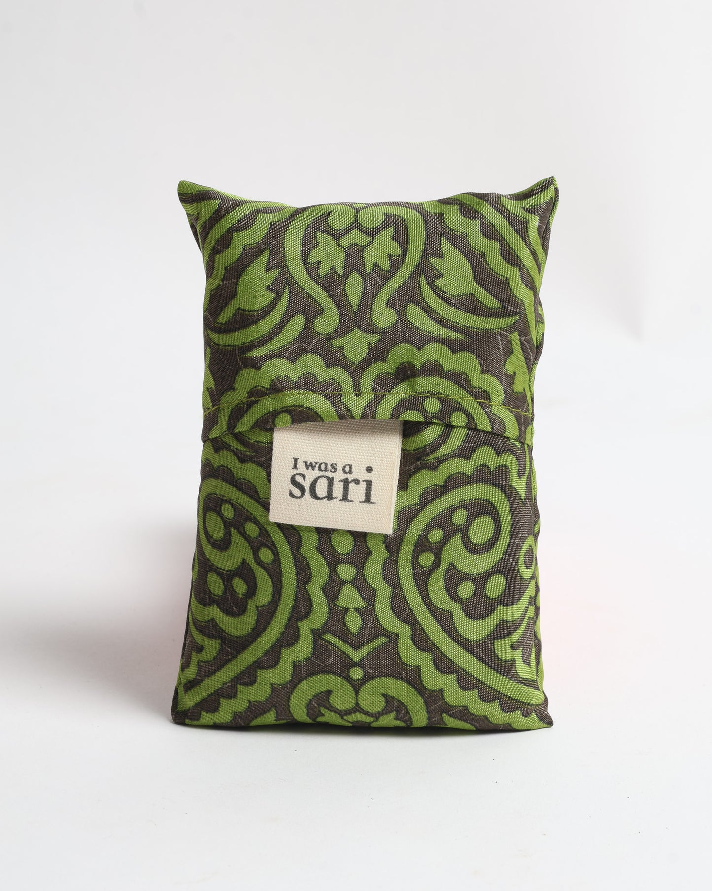 Stay eco-conscious with our Reusable Bag, handmade by Indian artisans from pre-loved saris. Silky and lightweight, this foldaway bag is perfect for your on-the-go lifestyle. Each piece is a unique statement of ethical fashion, embracing sustainability and style.