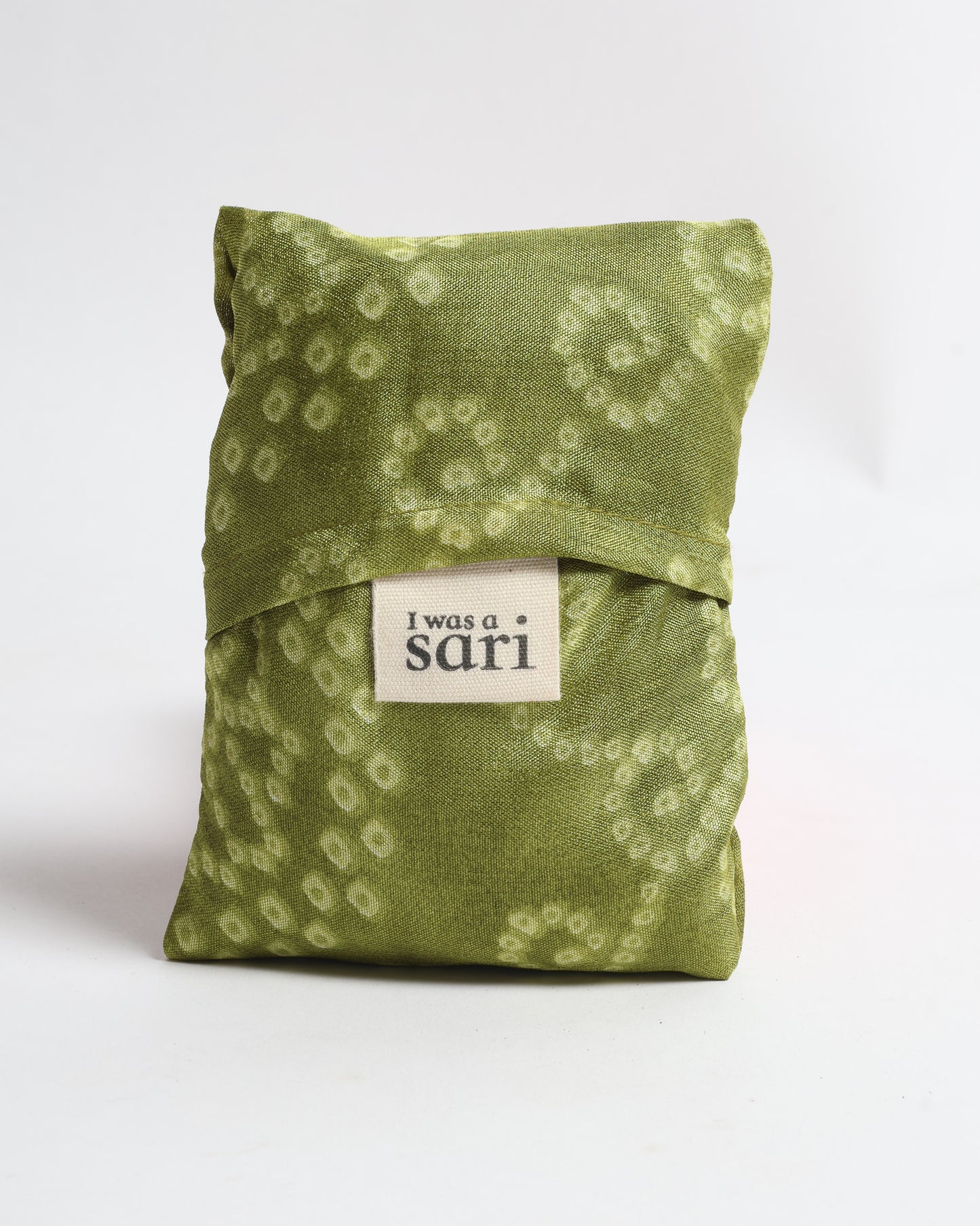 Stay eco-conscious with our Reusable Bag, handmade by Indian artisans from pre-loved saris. Silky and lightweight, this foldaway bag is perfect for your on-the-go lifestyle. Each piece is a unique statement of ethical fashion, embracing sustainability and style.