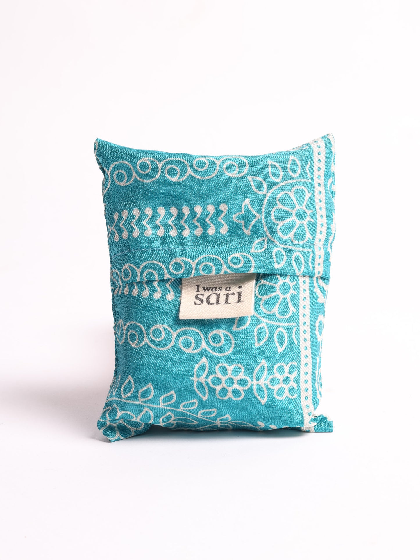 Stay eco-conscious with our Reusable Bag, handmade by Indian artisans from pre-loved saris. Silky and lightweight, this foldaway bag is perfect for your on-the-go lifestyle. Each piece is a unique statement of ethical fashion, embracing sustainability and style.