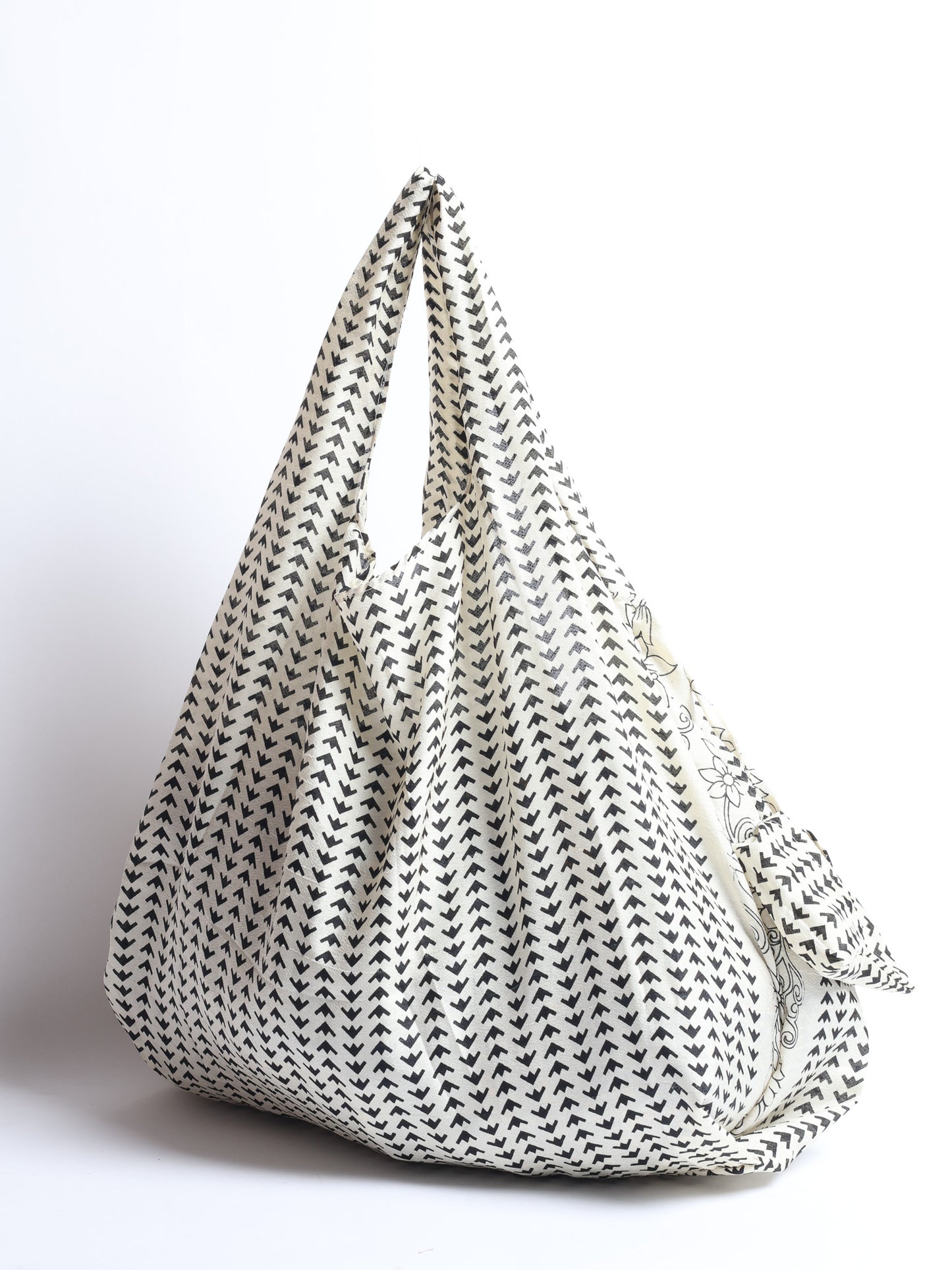 Stay eco-conscious with our Reusable Bag, handmade by Indian artisans from pre-loved saris. Silky and lightweight, this foldaway bag is perfect for your on-the-go lifestyle. Each piece is a unique statement of ethical fashion, embracing sustainability and style.