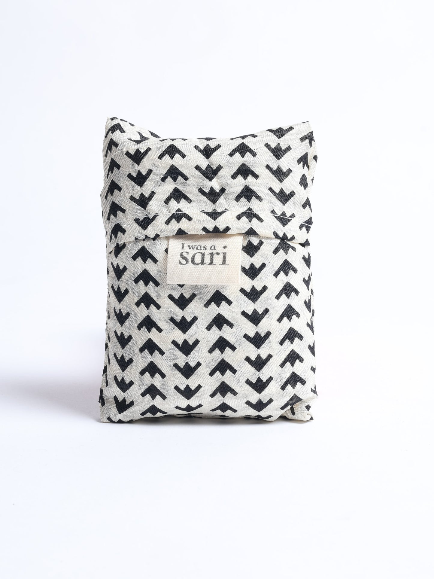 Stay eco-conscious with our Reusable Bag, handmade by Indian artisans from pre-loved saris. Silky and lightweight, this foldaway bag is perfect for your on-the-go lifestyle. Each piece is a unique statement of ethical fashion, embracing sustainability and style.