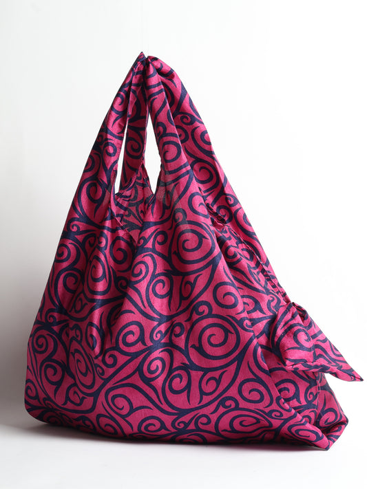 Stay eco-conscious with our Reusable Bag, handmade by Indian artisans from pre-loved saris. Silky and lightweight, this foldaway bag is perfect for your on-the-go lifestyle. Each piece is a unique statement of ethical fashion, embracing sustainability and style.