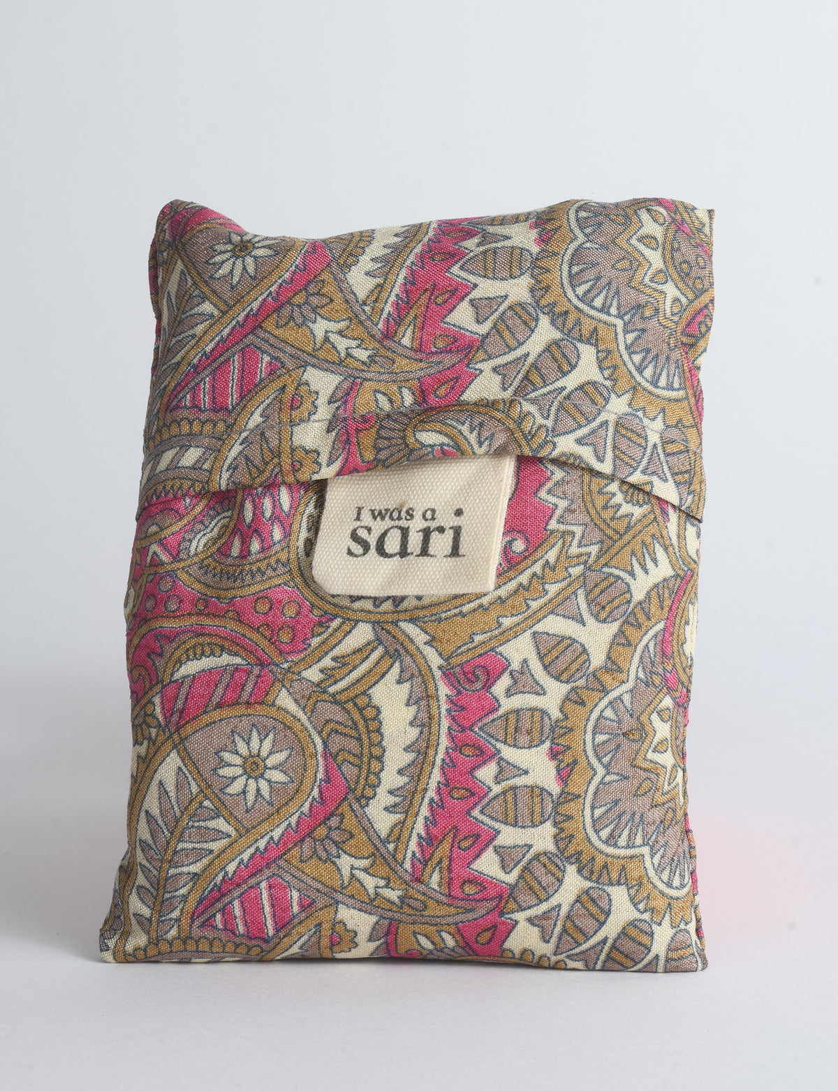 Blue reusable bag with multicolor tropical floral pattern folded with "I was a sari" label visible on front