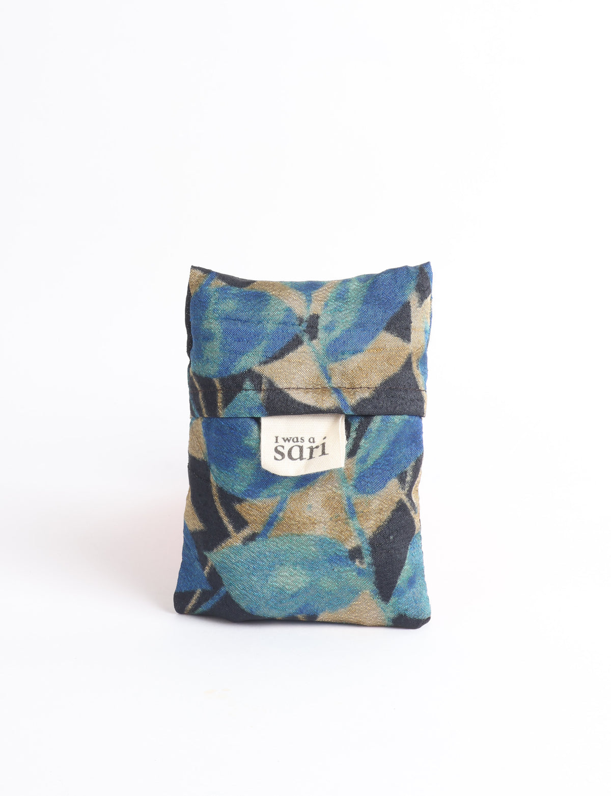 Blue reusable bag with multicolor tropical floral pattern folded with "I was a sari" label visible on front