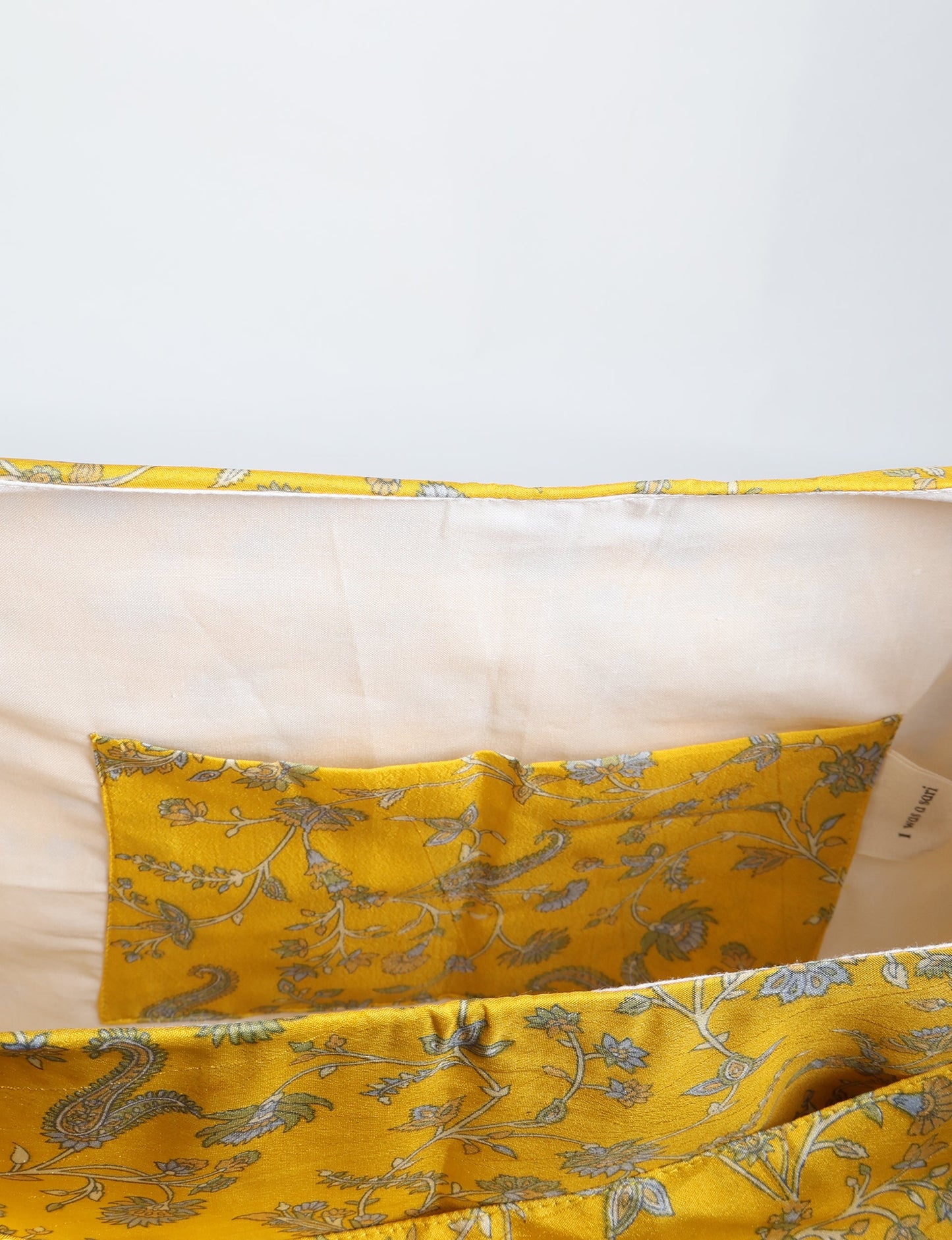 Trapeze bag made from repurposed sari fabric, featuring bold patterns and eco friendly cloth design—part of a sustainable women's clothing collection.