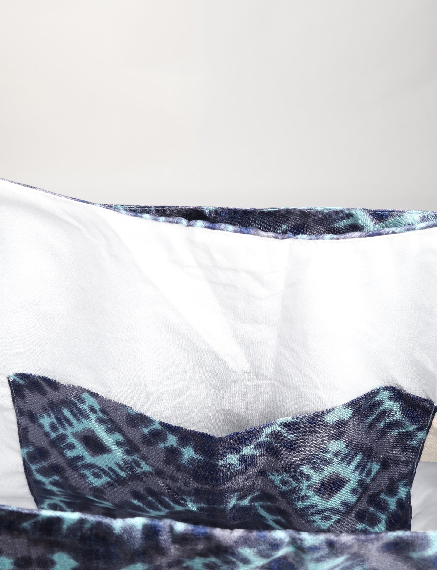 Trapeze bag made from repurposed sari fabric, featuring bold patterns and eco friendly cloth design—part of a sustainable women's clothing collection.