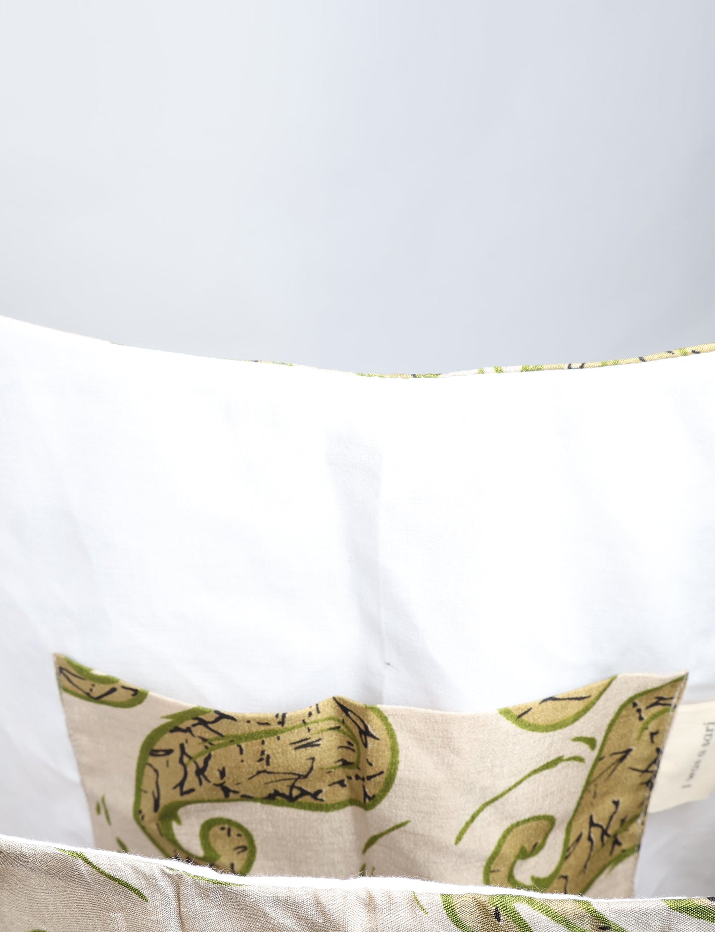 Trapeze bag made from repurposed sari fabric, featuring bold patterns and eco friendly cloth design—part of a sustainable women's clothing collection.