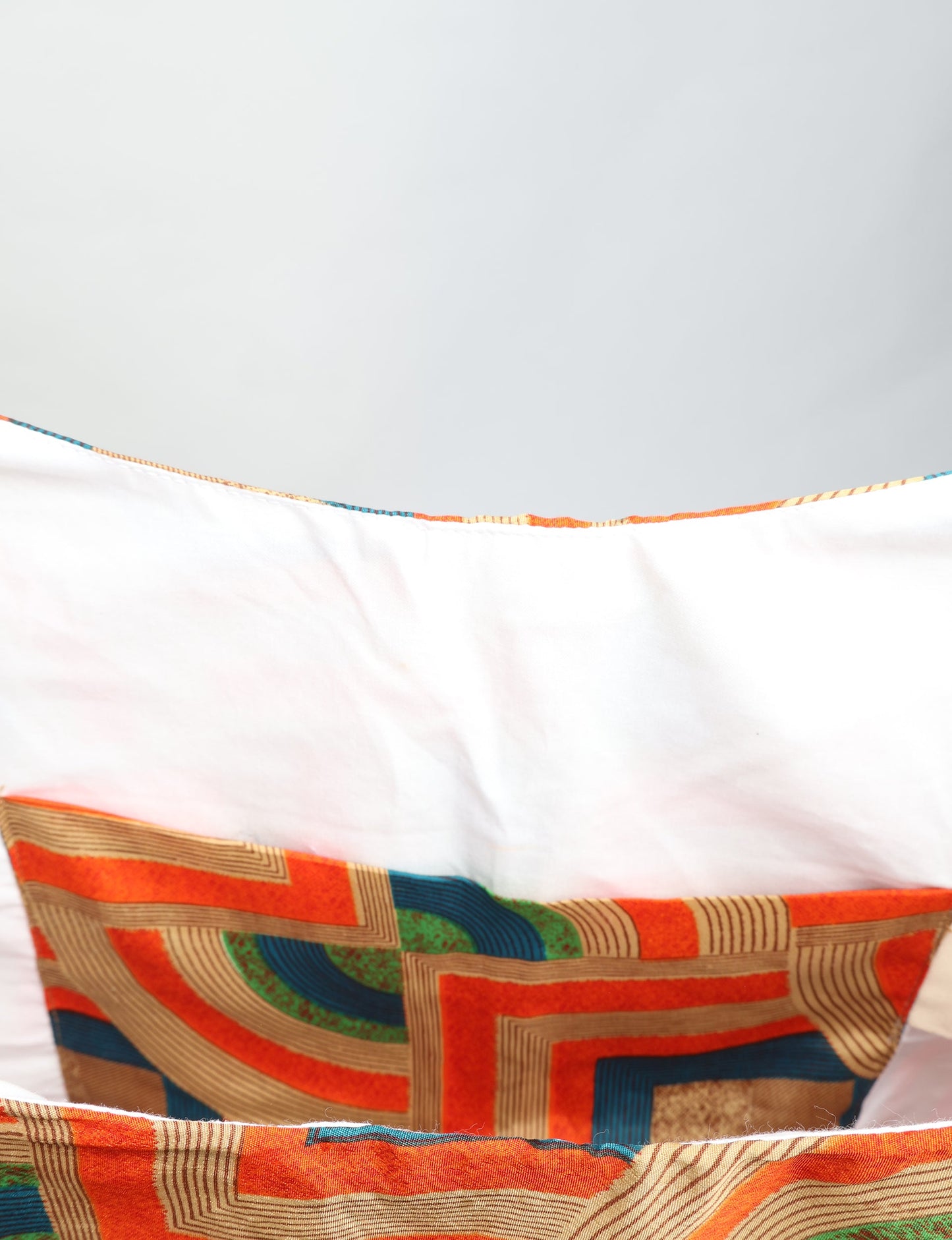 Trapeze bag made from repurposed sari fabric, featuring bold patterns and eco friendly cloth design—part of a sustainable women's clothing collection.