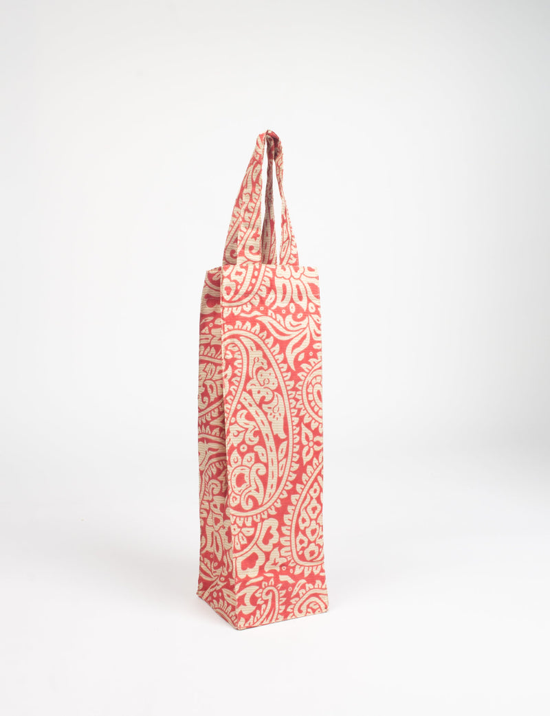 Orange and beige paisley patterned fabric wine bag with handles, shown standing upright on a white background