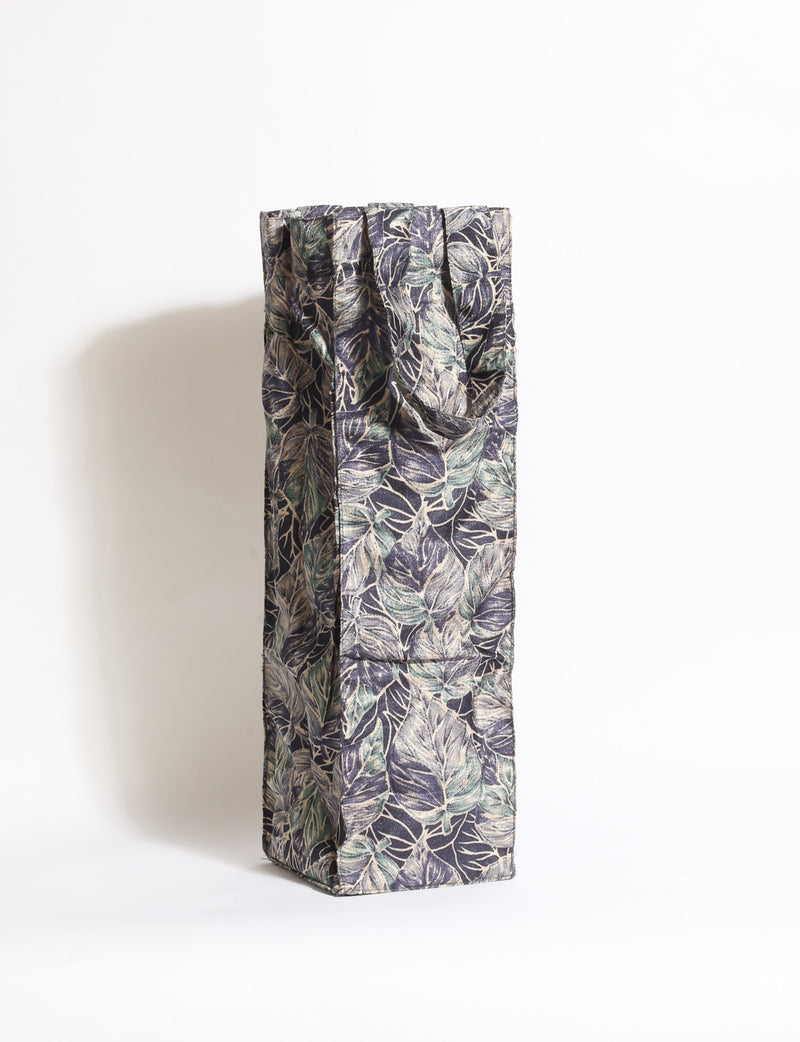 Indulge in eco-conscious wine storage with our Wine Bags, handcrafted from pre-loved saris by Mumbai craftswomen. Sturdy and stylish, these rectangular bags with small handles ensure a leak-free, eco-friendly solution for carrying and storing regular and sparkling wine bottles.
