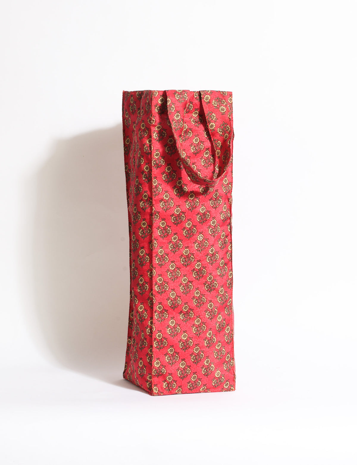 Indulge in eco-conscious wine storage with our Wine Bags, handcrafted from pre-loved saris by Mumbai craftswomen. Sturdy and stylish, these rectangular bags with small handles ensure a leak-free, eco-friendly solution for carrying and storing regular and sparkling wine bottles.