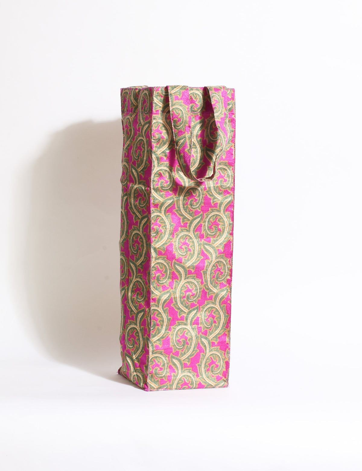 Indulge in eco-conscious wine storage with our Wine Bags, handcrafted from pre-loved saris by Mumbai craftswomen. Sturdy and stylish, these rectangular bags with small handles ensure a leak-free, eco-friendly solution for carrying and storing regular and sparkling wine bottles.