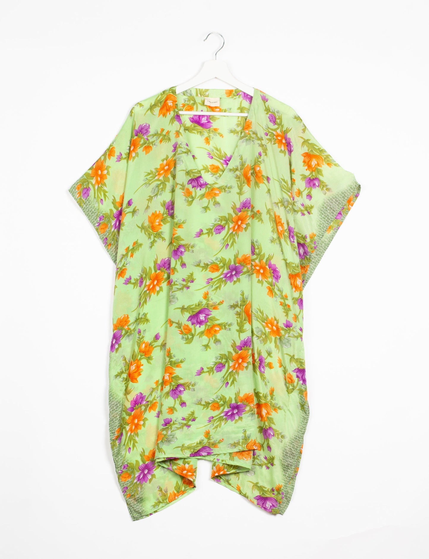 Flowing and festive KAFTAN, an essential for your getaway wardrobe. Versatile for at-home lounging or poolside cocktails. Accessorize with our silk pouches or tote bag for a socially-conscious and stylish look, perfect even for dinner outings. Crafted from sustainable materials, this eco-friendly kaftan adds a touch of conscious fashion to your style.