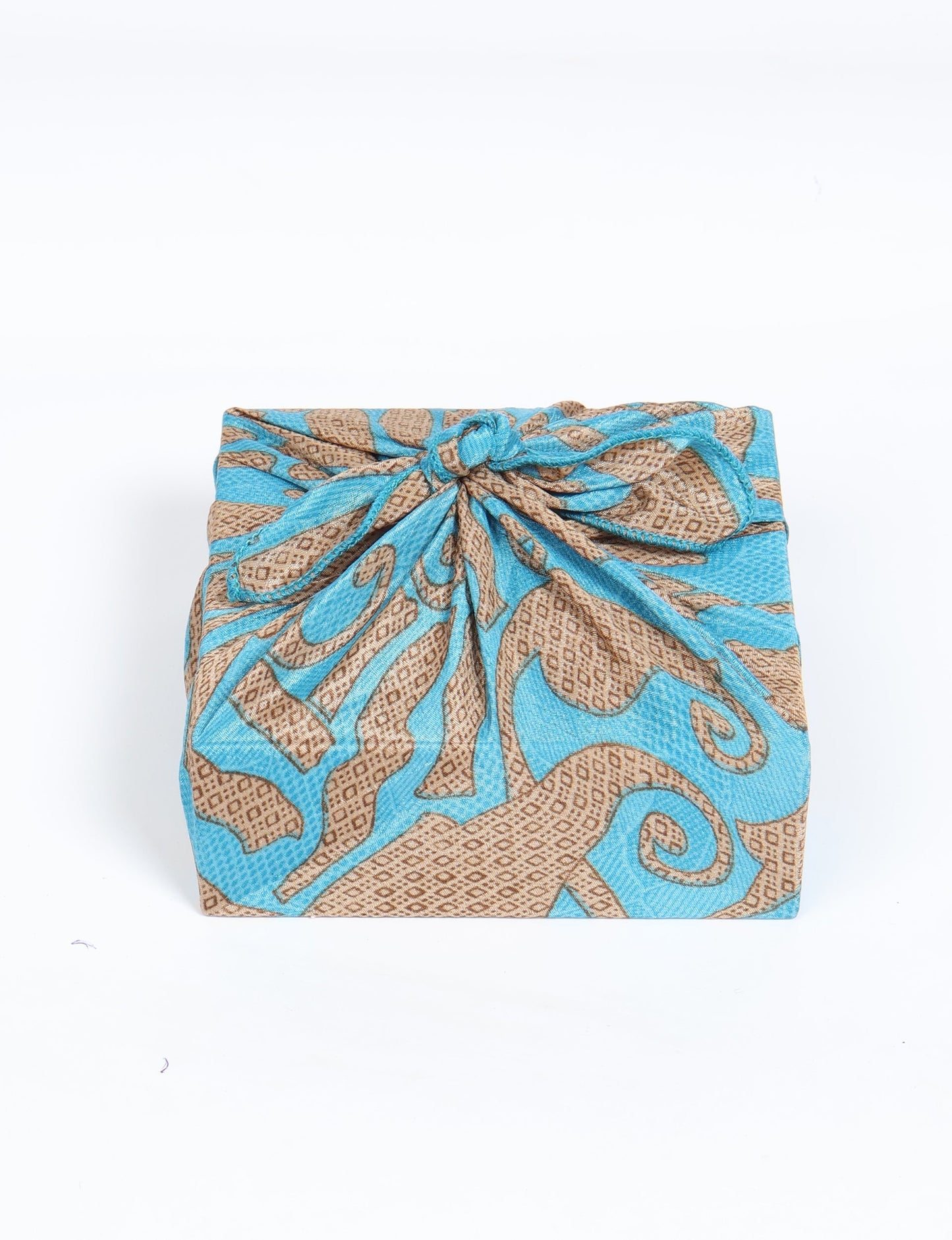 A delicately handcrafted wrap made from recycled sari offcuts, blending sustainable fashion with conscious design. This eco-friendly product showcases the beauty of upcycling and green fashion, making it a perfect accessory for those supporting circular fashion and products made from textile waste.