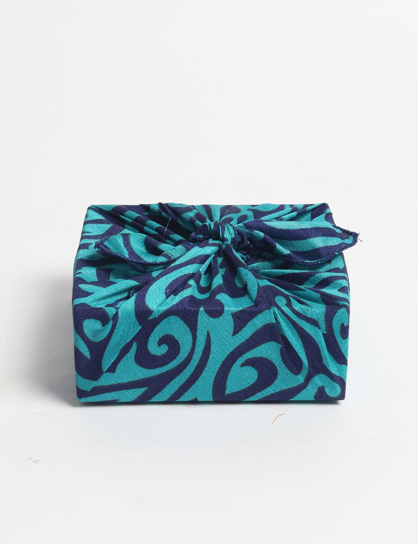 A delicately handcrafted wrap made from recycled sari offcuts, blending sustainable fashion with conscious design. This eco-friendly product showcases the beauty of upcycling and green fashion, making it a perfect accessory for those supporting circular fashion and products made from textile waste.