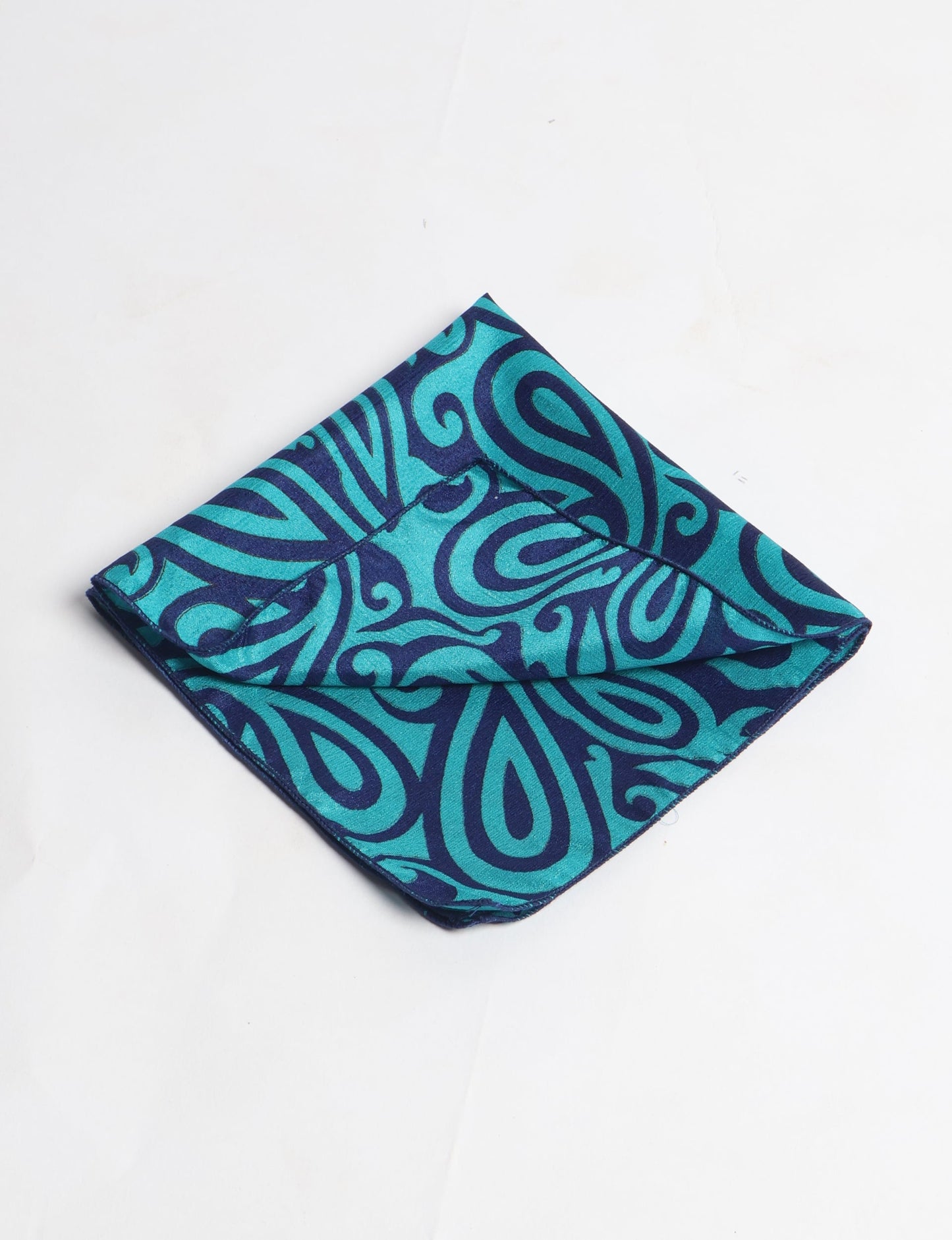 A delicately handcrafted wrap made from recycled sari offcuts, blending sustainable fashion with conscious design. This eco-friendly product showcases the beauty of upcycling and green fashion, making it a perfect accessory for those supporting circular fashion and products made from textile waste.