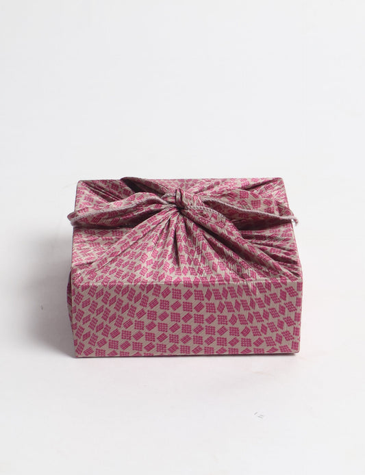 A delicately handcrafted wrap made from recycled sari offcuts, blending sustainable fashion with conscious design. This eco-friendly product showcases the beauty of upcycling and green fashion, making it a perfect accessory for those supporting circular fashion and products made from textile waste.