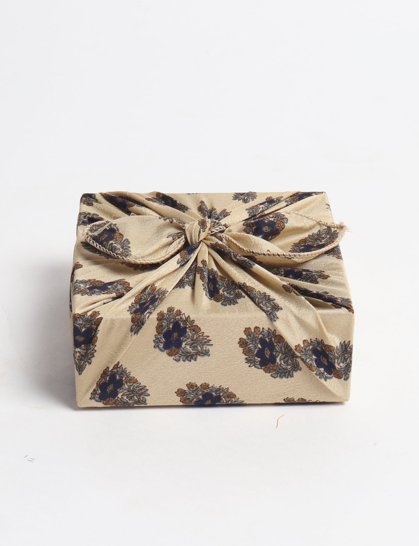 A delicately handcrafted wrap made from recycled sari offcuts, blending sustainable fashion with conscious design. This eco-friendly product showcases the beauty of upcycling and green fashion, making it a perfect accessory for those supporting circular fashion and products made from textile waste.