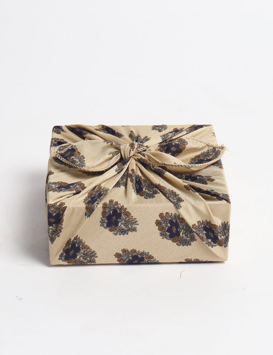 A delicately handcrafted wrap made from recycled sari offcuts, blending sustainable fashion with conscious design. This eco-friendly product showcases the beauty of upcycling and green fashion, making it a perfect accessory for those supporting circular fashion and products made from textile waste.