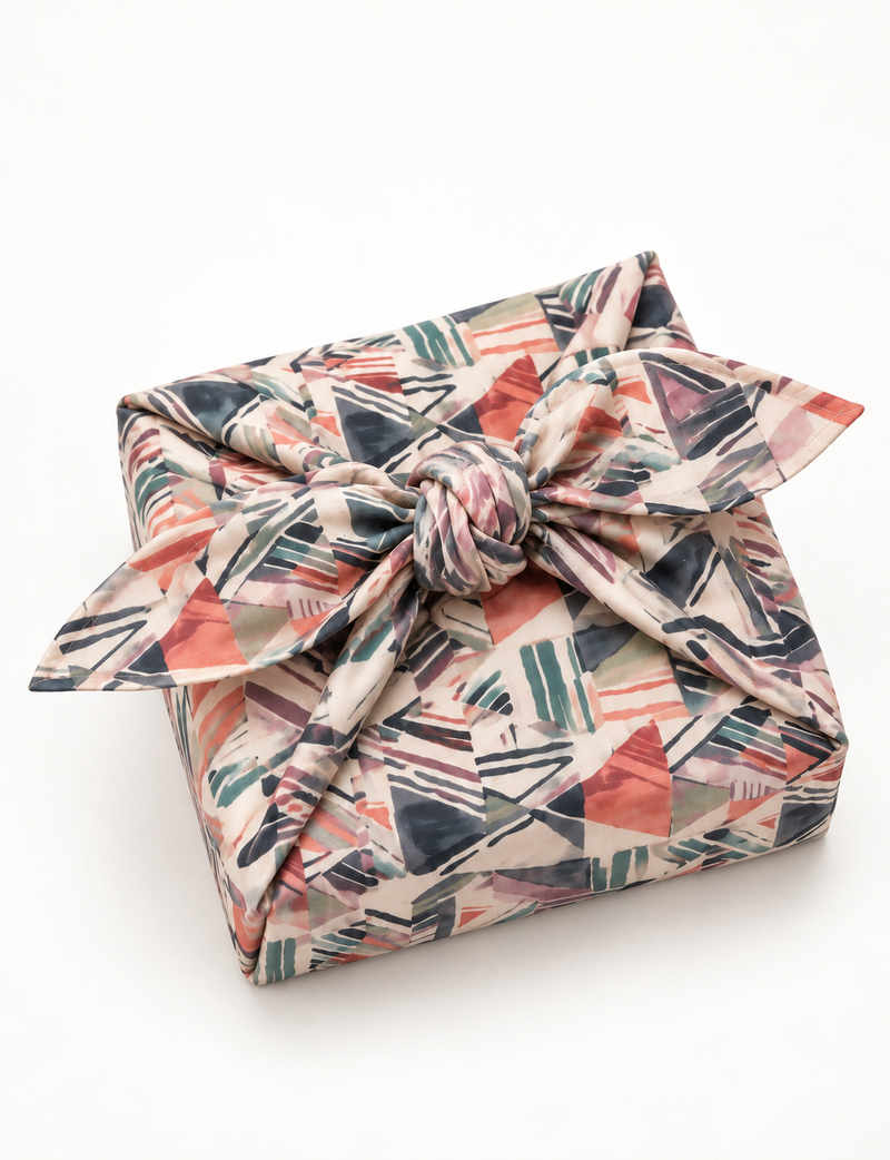 A delicately handcrafted wrap made from recycled sari offcuts, blending sustainable fashion with conscious design. This eco-friendly product showcases the beauty of upcycling and green fashion, making it a perfect accessory for those supporting circular fashion and products made from textile waste.