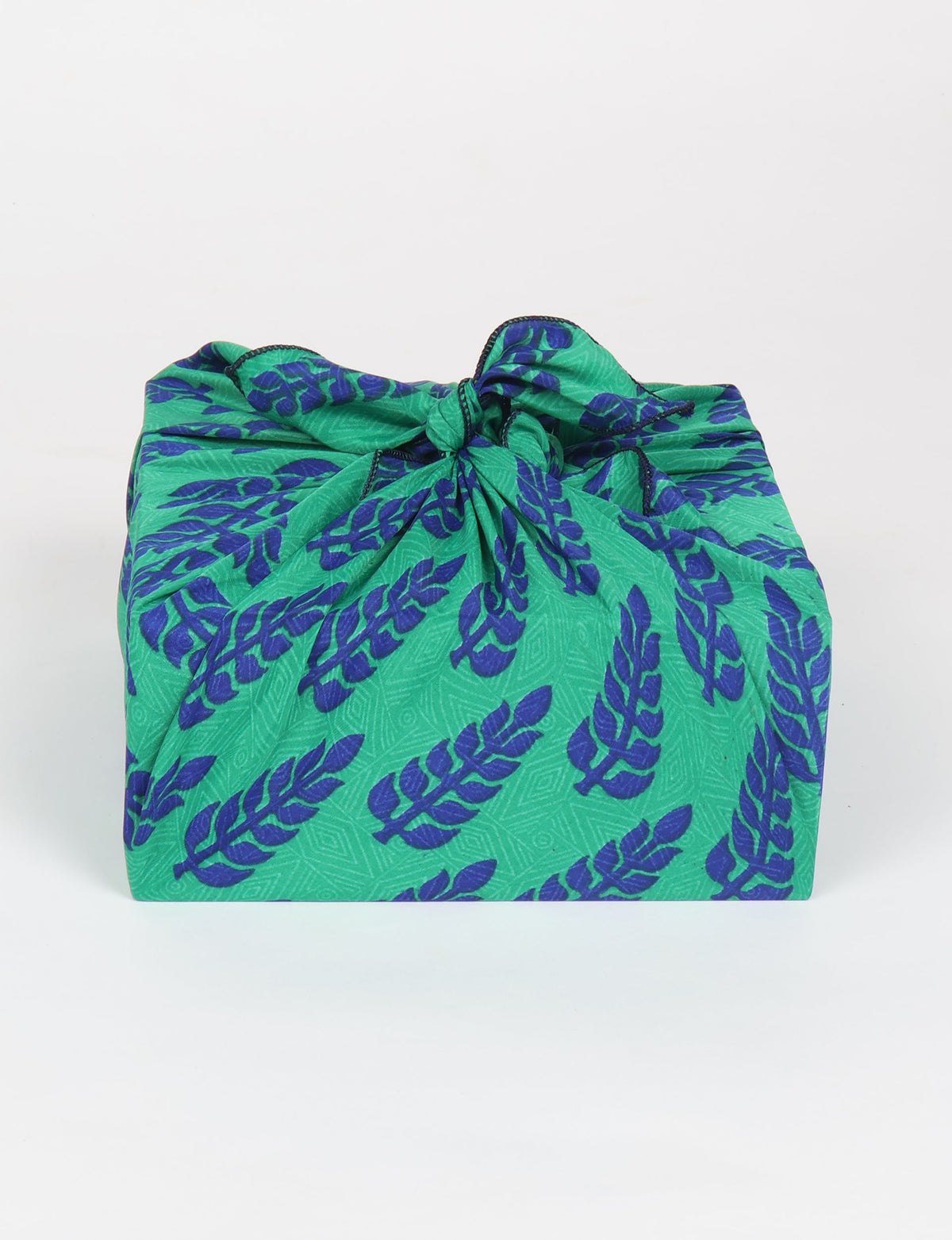 A delicately handcrafted wrap made from recycled sari offcuts, blending sustainable fashion with conscious design. This eco-friendly product showcases the beauty of upcycling and green fashion, making it a perfect accessory for those supporting circular fashion and products made from textile waste.