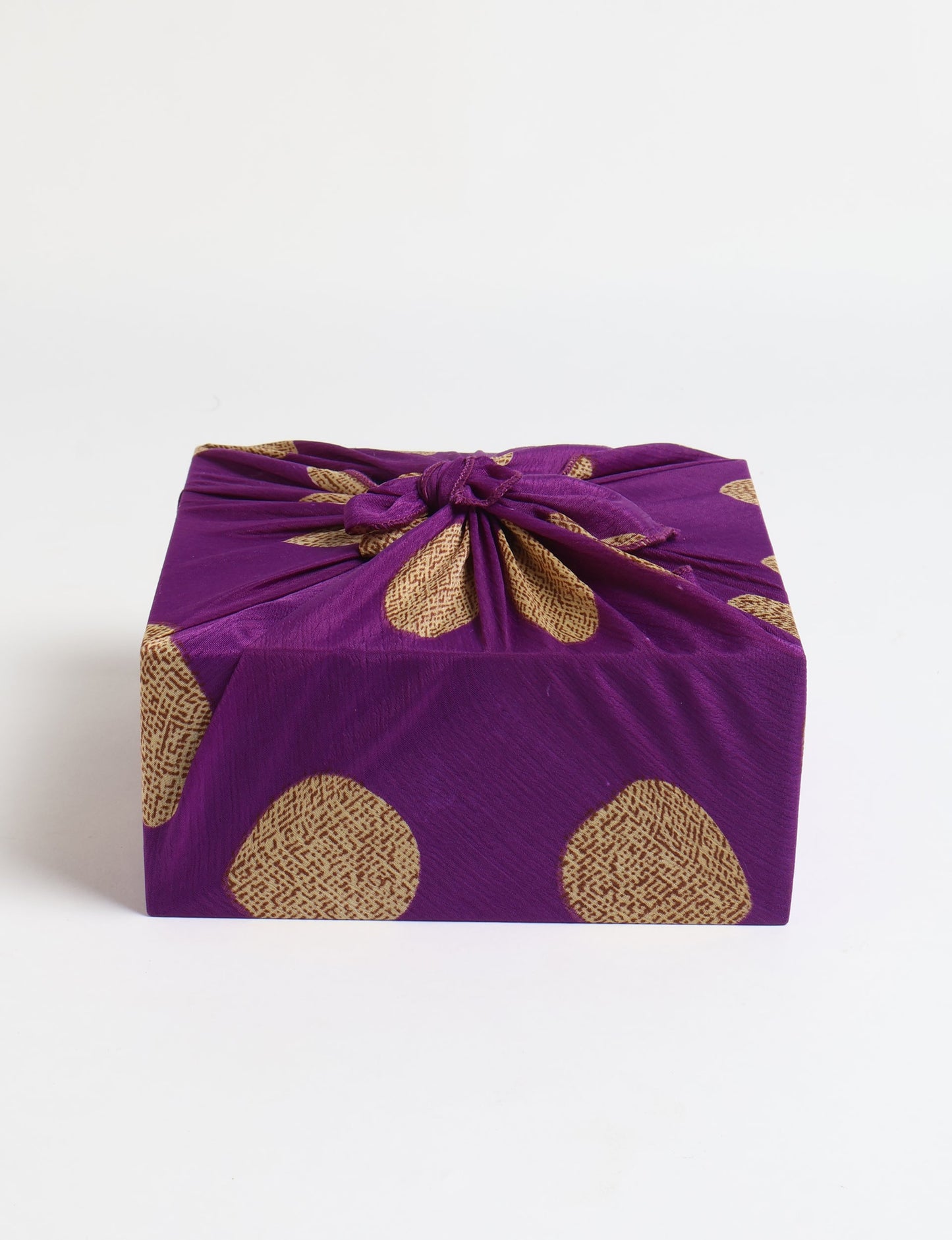 A delicately handcrafted wrap made from recycled sari offcuts, blending sustainable fashion with conscious design. This eco-friendly product showcases the beauty of upcycling and green fashion, making it a perfect accessory for those supporting circular fashion and products made from textile waste.