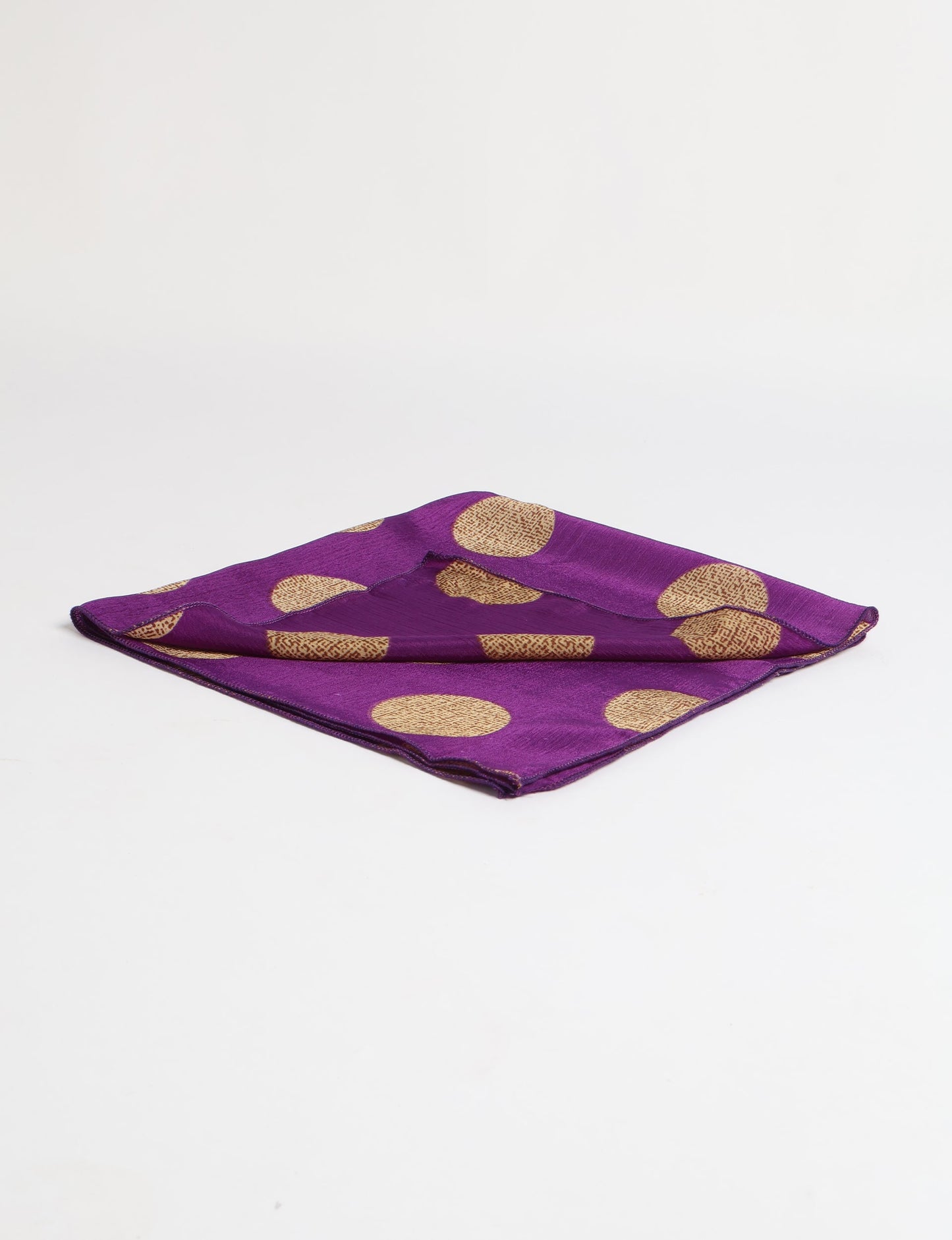 A delicately handcrafted wrap made from recycled sari offcuts, blending sustainable fashion with conscious design. This eco-friendly product showcases the beauty of upcycling and green fashion, making it a perfect accessory for those supporting circular fashion and products made from textile waste.