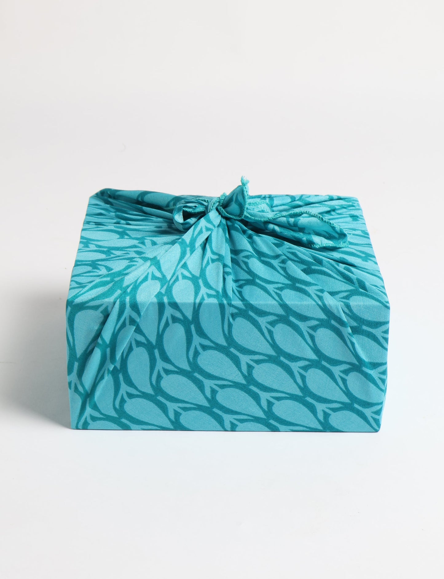 A delicately handcrafted wrap made from recycled sari offcuts, blending sustainable fashion with conscious design. This eco-friendly product showcases the beauty of upcycling and green fashion, making it a perfect accessory for those supporting circular fashion and products made from textile waste.